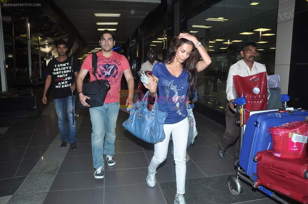 Malaika Arora Khan, Arbaaz Khan return from Singapore after attending IIFA Awards in Mumbai on 12th June 2012
