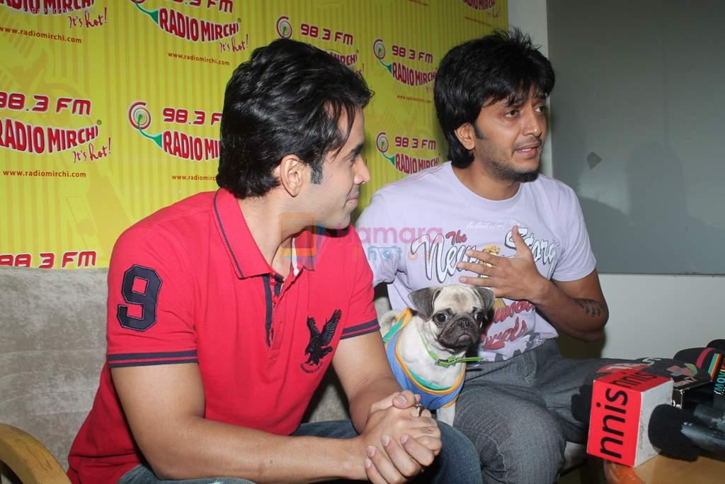 Ritesh Deshmukh, Tusshar Kapoor with dog Macho on the sets of Radio Mirchi to promote Kya Super Kool Hain Hum in Lower parel, Mumbai on 25th June 2012