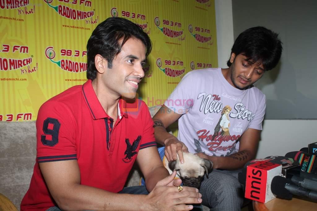 Ritesh Deshmukh, Tusshar Kapoor with dog Macho on the sets of Radio Mirchi to promote Kya Super Kool Hain Hum in Lower parel, Mumbai on 25th June 2012