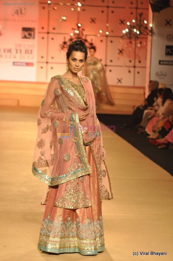 Model walk the ramp for Ashima Leena show at PCJ Delhi Couture Week on 9th Aug 2012