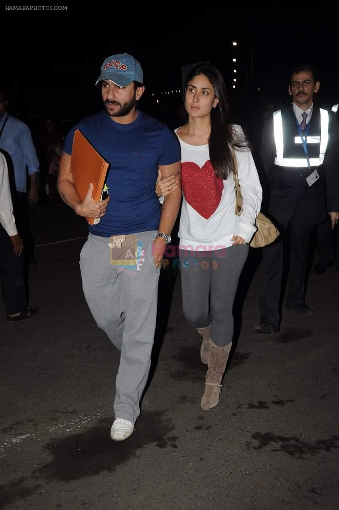 Saif Ali Khan,Kareena Kapoor snapped at the airport in Mumbai on 12th Aug 2012