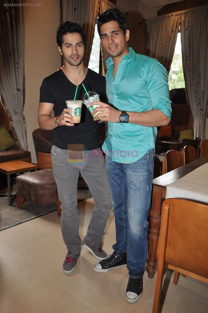 Varun Dhawan, Siddharth Malhotra at Student of the year launch Starbucks new shop in Mumbai on 24th Oct 2012