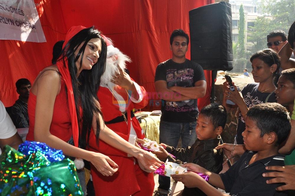 Sherlyn Chopra First Indian Playboy Cover Girl turns Santa for street kids of The Ray of Hope NGO in Mumbai on 16th Dec 2012