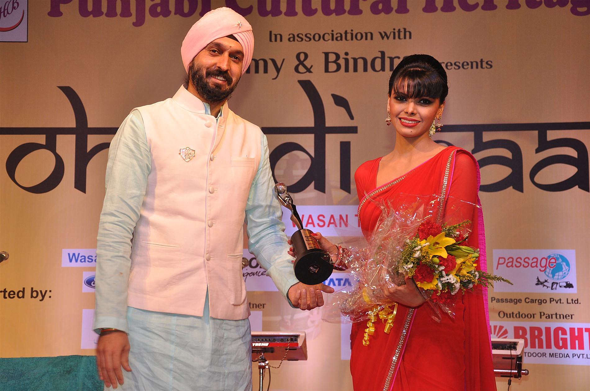 Sherlyn Chopra receives Celebrity Award at MLC Charan Singh Sapra's Lohri night on 12th Jan 2012
