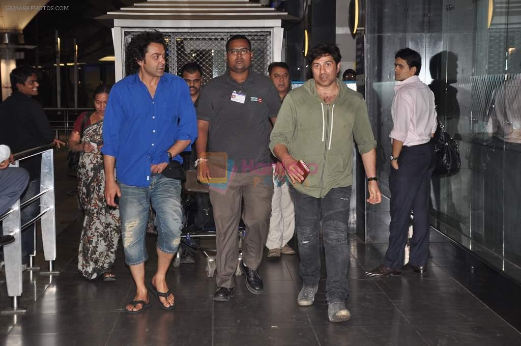 Sunny Deol and Bobby Deol snapped at the airport returning from bangkok after shoot in Mumbai on 13th March 2013