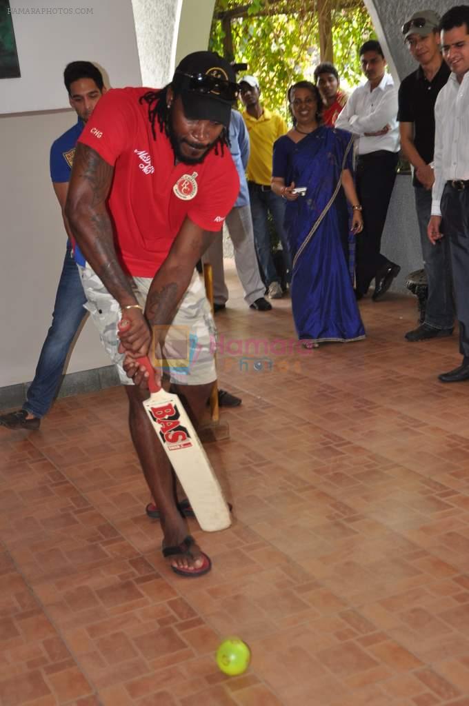 Chris Gayle spend time with NGO kids in Worli, Mumbai on 26th April 2013