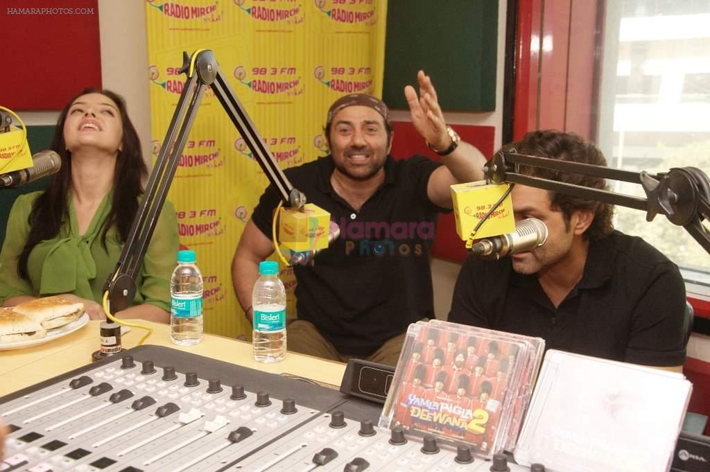 Kristina Akheeva and Sunny Deol at Radio Mirchi studio for the promotion of Yamla Pagla Deewana 2 in Lower Parel, Mumbai on 16th May 2013