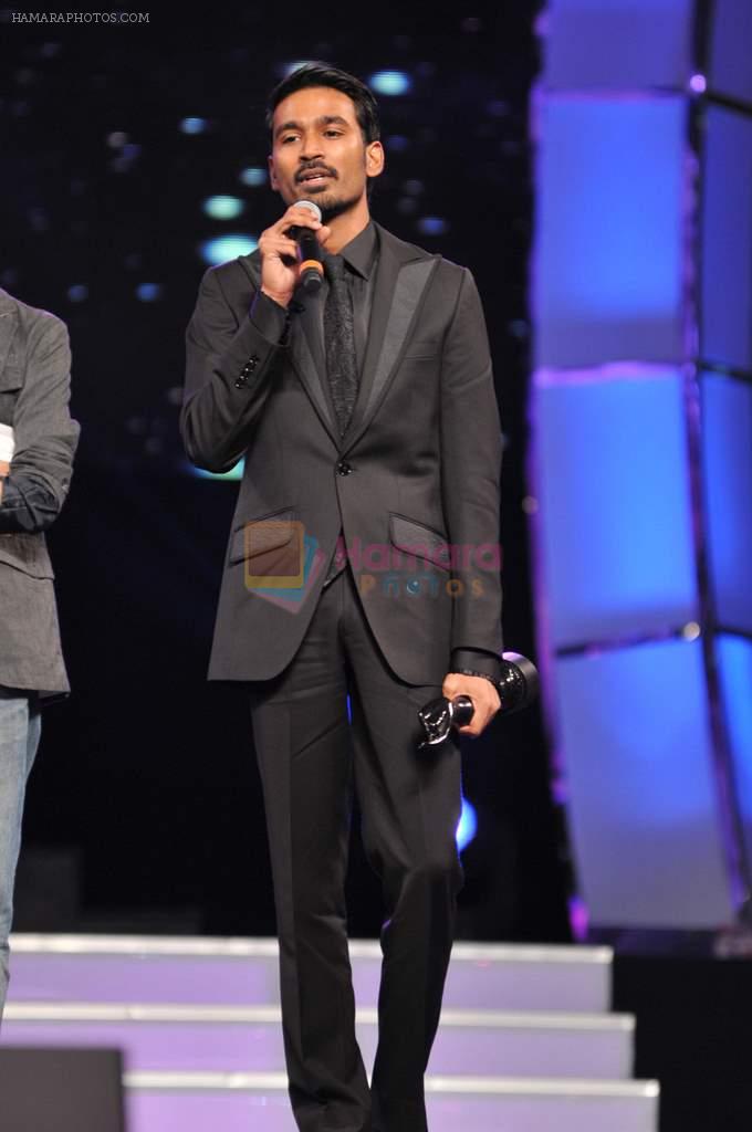 Dhanush receives the Best Actor - Male award for the movie 3 during the 60th Filmfare Awards