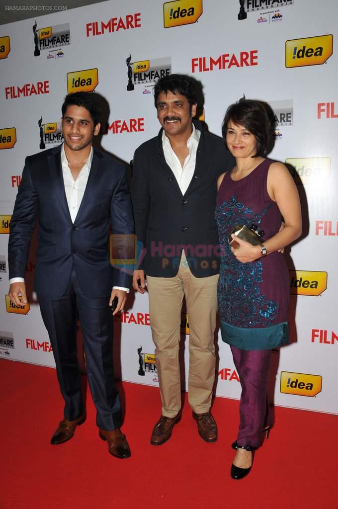 Naga Chaitanya, Nagarjuna and Amala on the Red Carpet of _60the Idea Filmfare Awards 2012