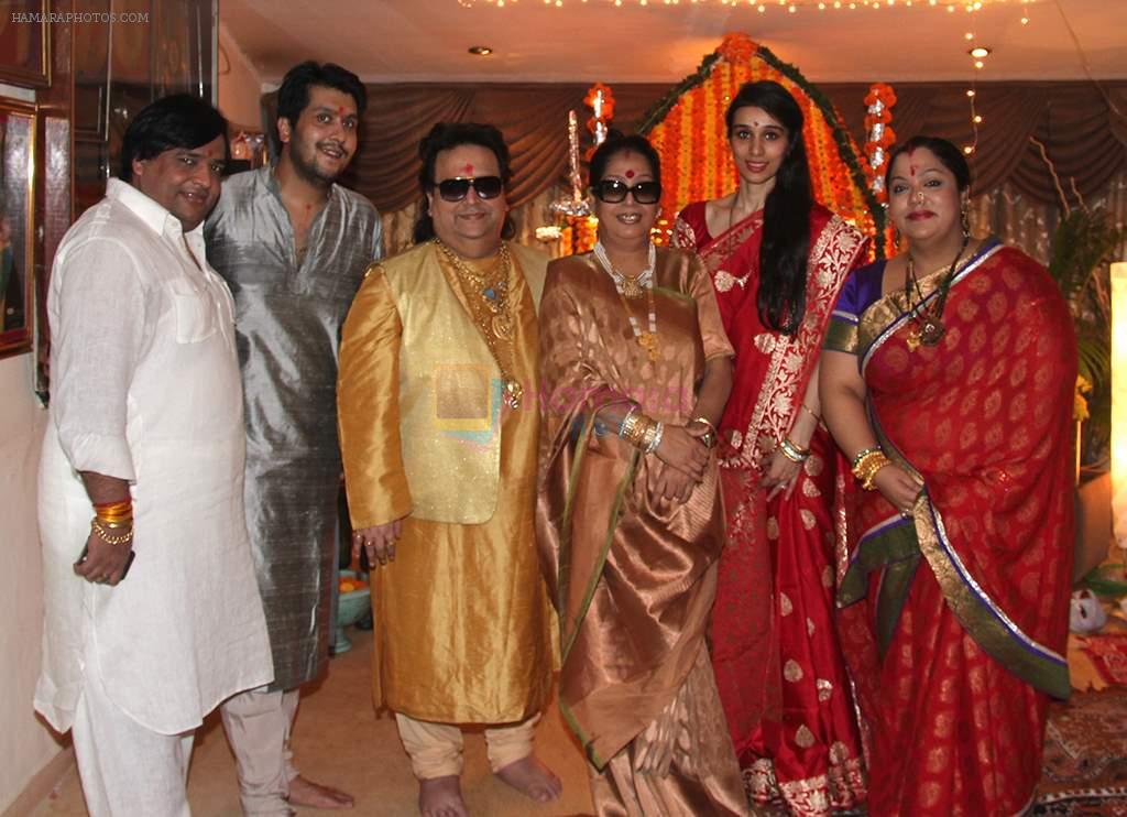 Govind Bansal, Bappa Lahiri, Bappi Lahiri, Chitrani Lahiri, Tanisha Verma Lahiri, Rema Bansal at Bappi Lahiri's Ganpati celebrations in Mumbai on 9th Sept 2013