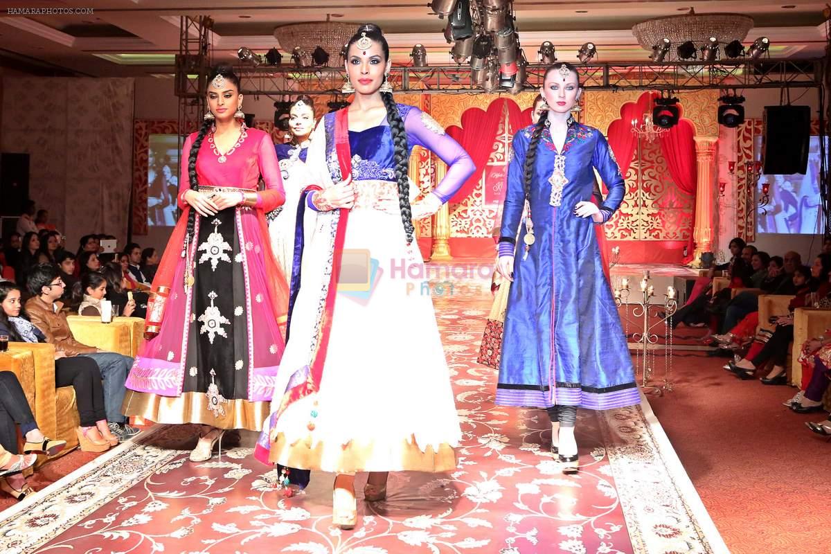 Model walks on ramp & presenting Wedding collection designed by Kavita and Meenu during a fashion show on 25th dec 2013