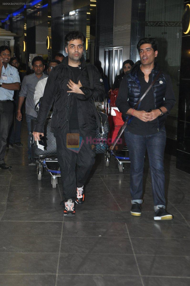 Karan Johar, Manish Malhotra arrive back in Mumbai post new year celebrations in Mumbai on 2nd Jan 2014