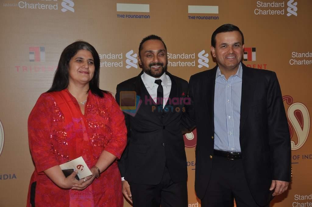 Rahul Bose flanked by Sunil Kaushal of Standard Chartered Bank and his wife at Standard Chartered Event in Trident, Mumbai on 22nd Feb 2014