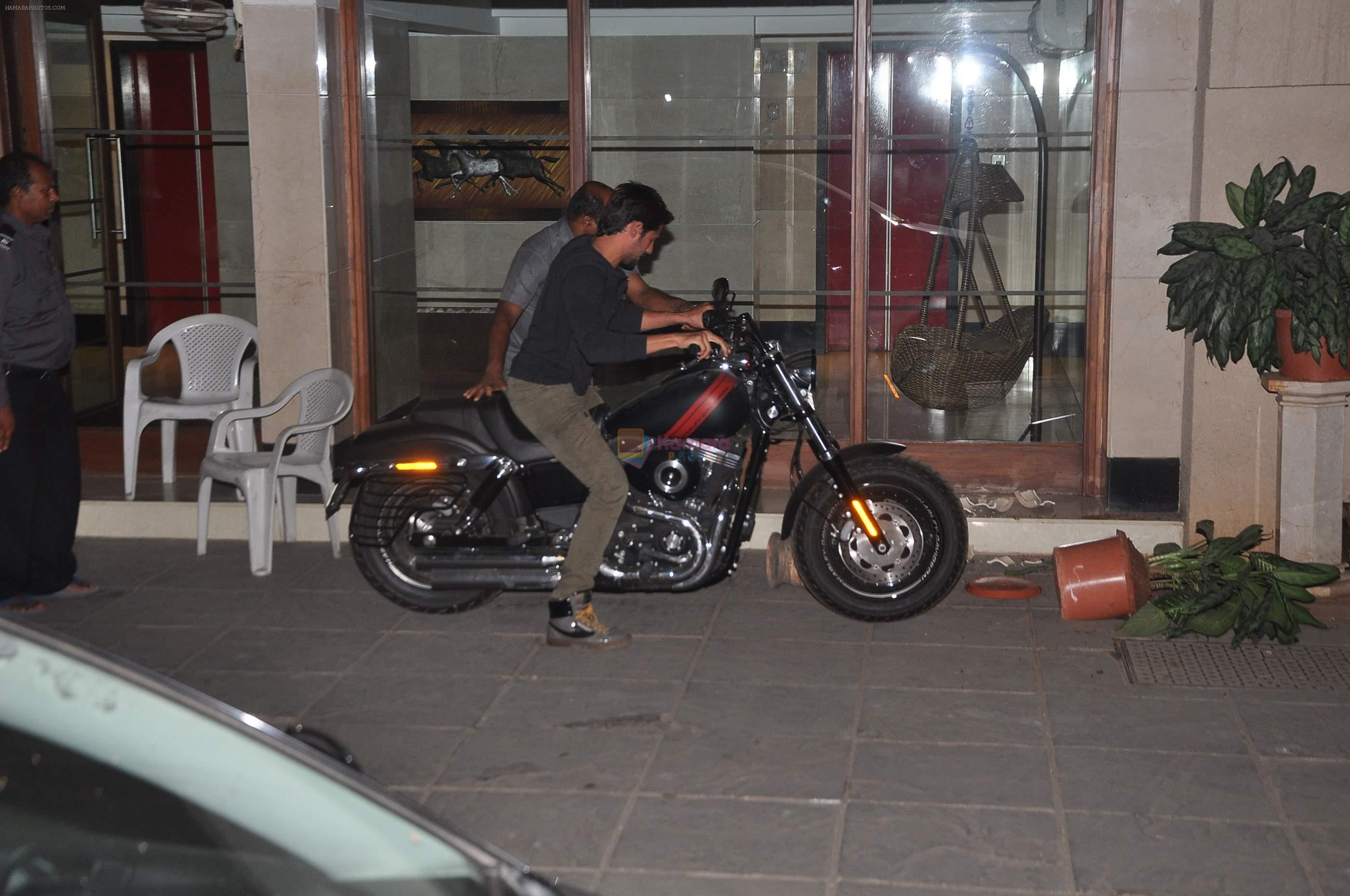 Siddharth Malhotra snapped outside Karan's house on a bike smashing pots in Mumbai on 19th March 2014