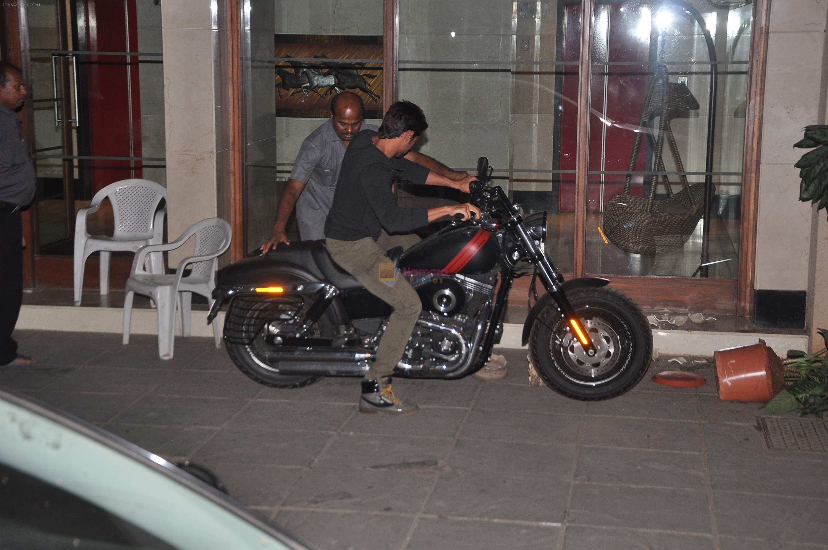 Siddharth Malhotra snapped outside Karan's house on a bike smashing pots in Mumbai on 19th March 2014