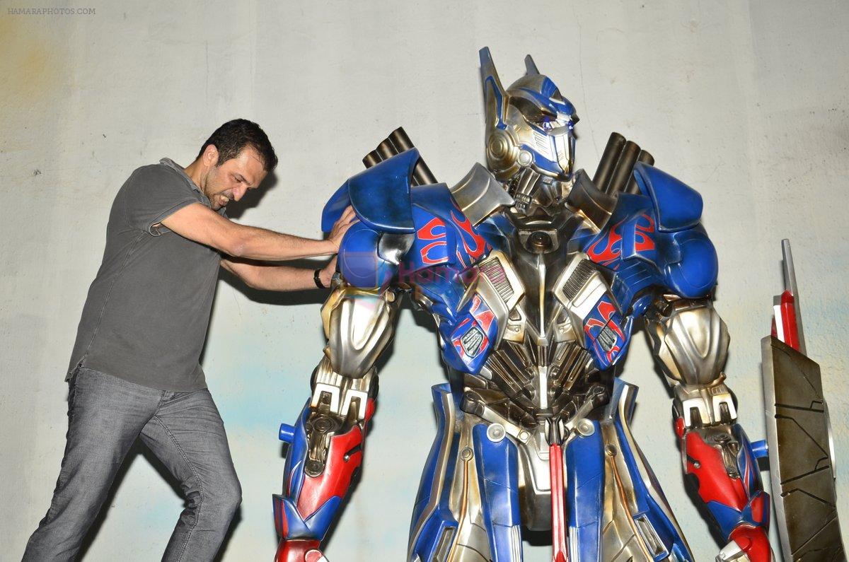 Atul Kasbekar pose with Optimus Prime to promote Transformers in Mehboob on 11th June 2014