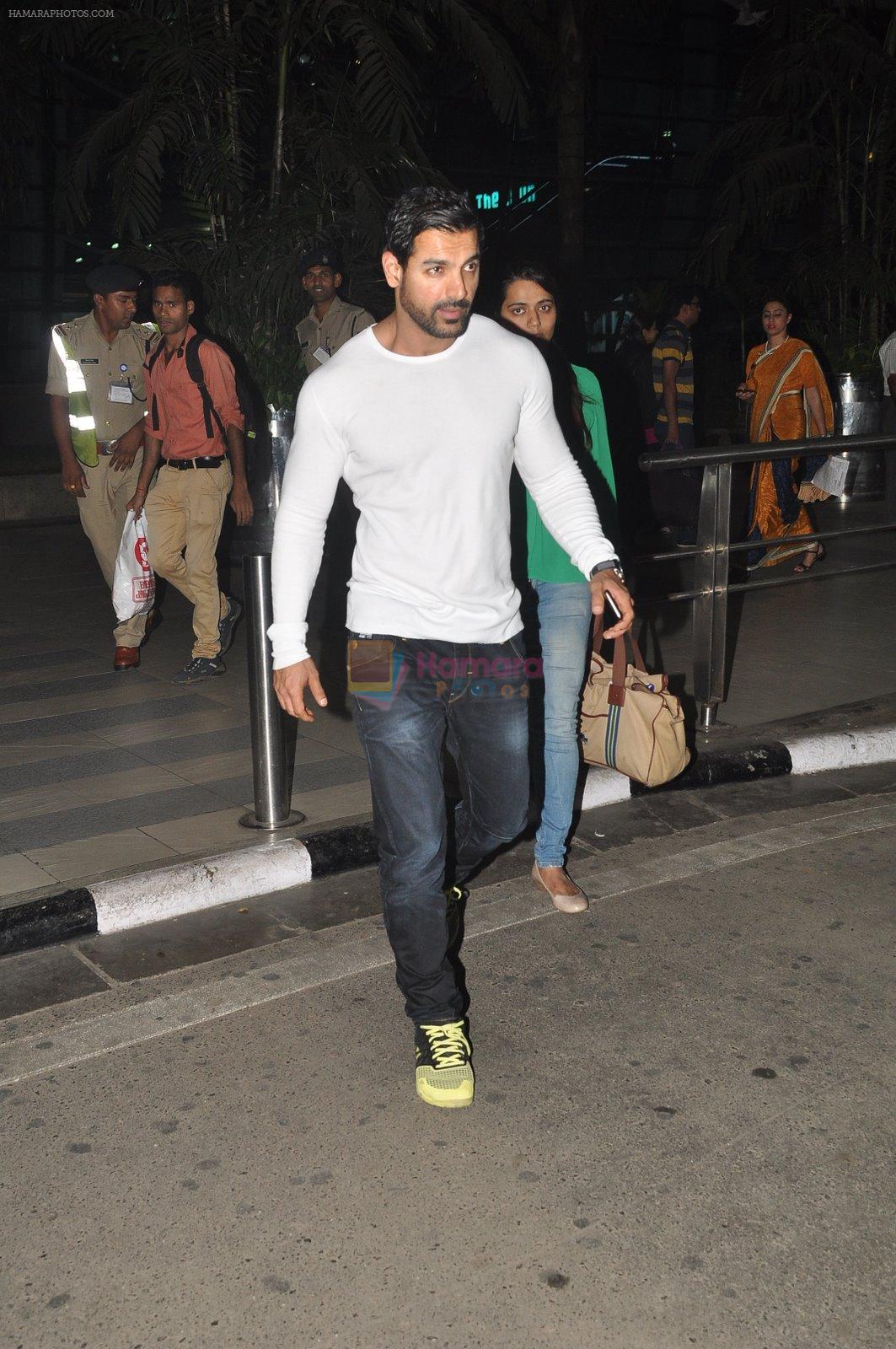 John Abraham snapped at airport in Mumbai on 11th Dec 2014