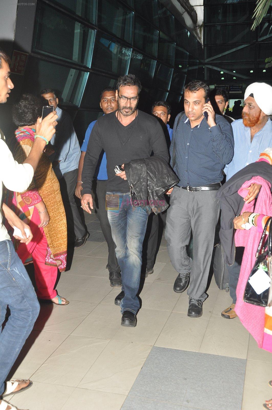 Ajay devgan snapped at airport in Mumbai on 12th Dec 2014