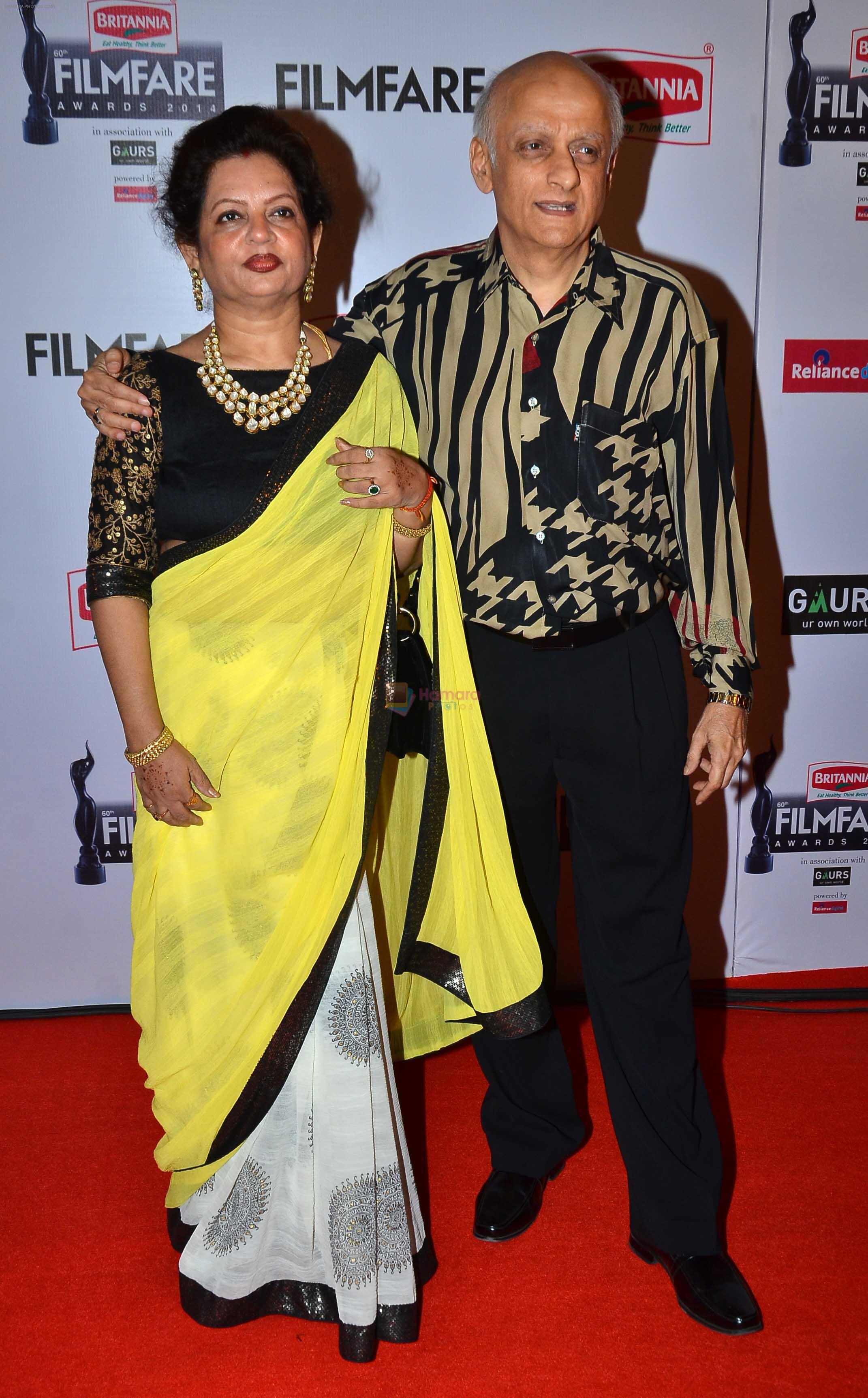 Mukesh Bhatt poses with his wife graces the red carpet at the 60th Britannia Filmfare Awards