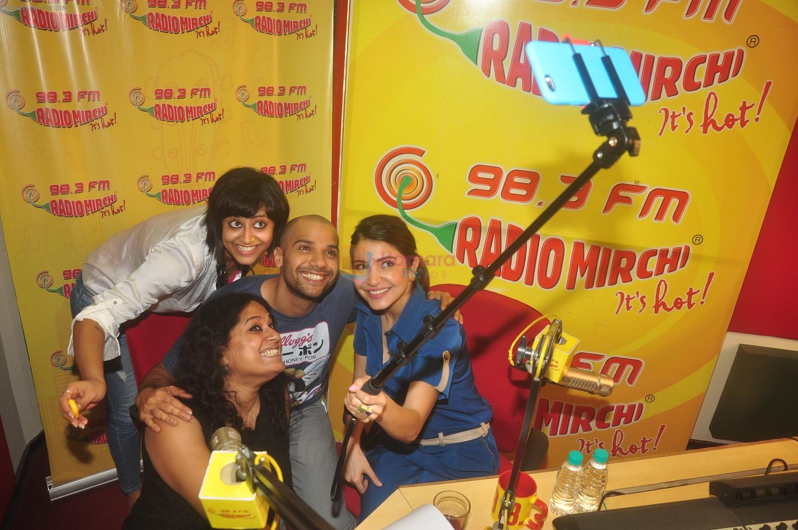 Anushka Sharma and Neil Bhoopalam with RJ Prackriti and RJ Sangeeta taking a selfie at Radio Mirchi studio