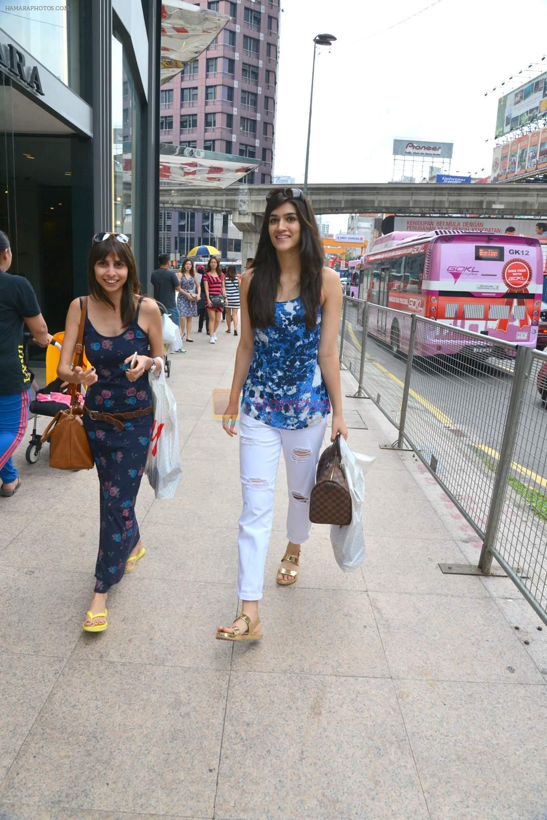 Kriti Sanon snapped shopping with a friend without any security guards on the streets of Kuala Lampur on 11th June 2015