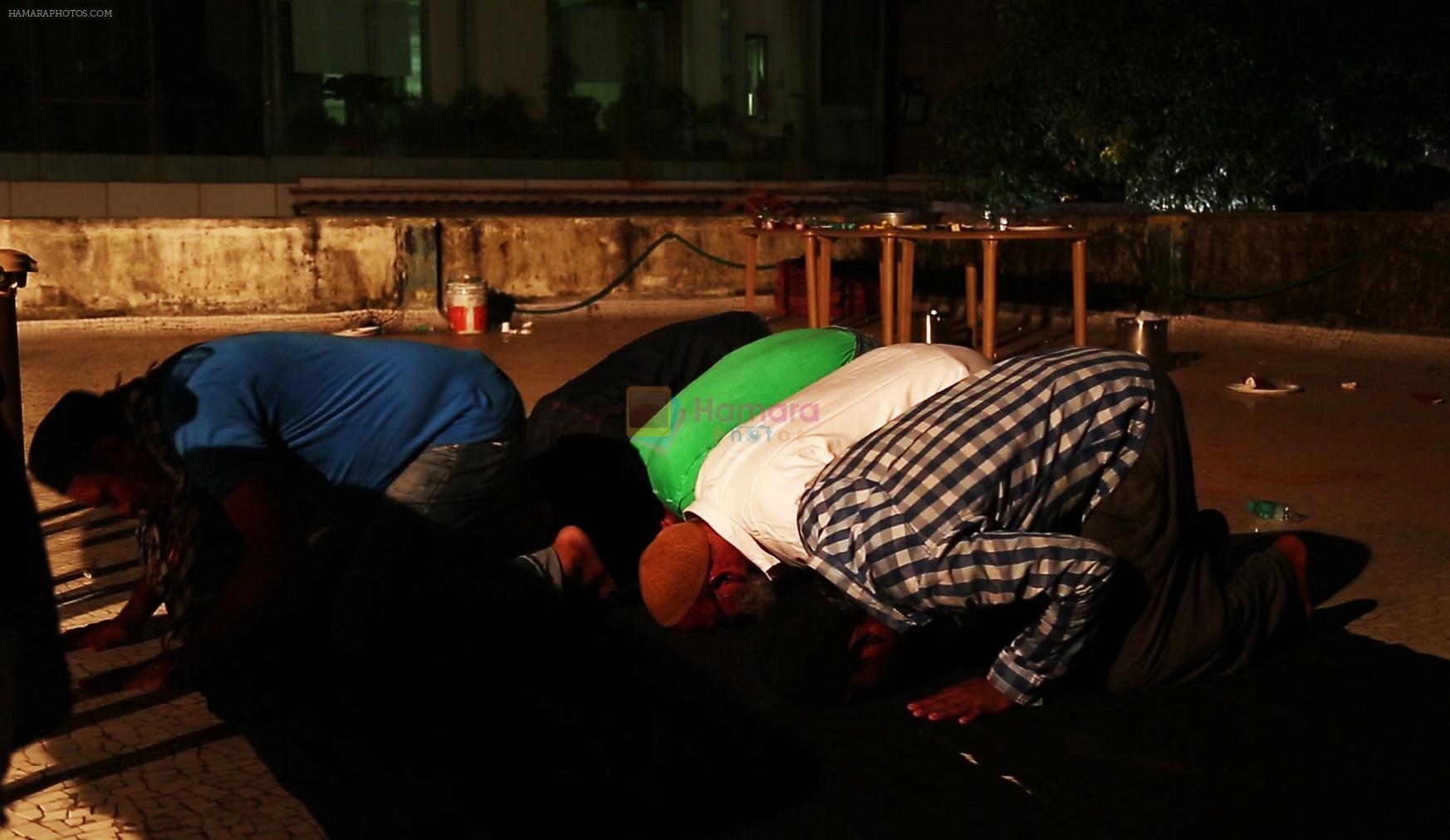 Crew members doing prayer before Iftaar party during the shoot of Surani Pictures  _Chalk N Duster_.2