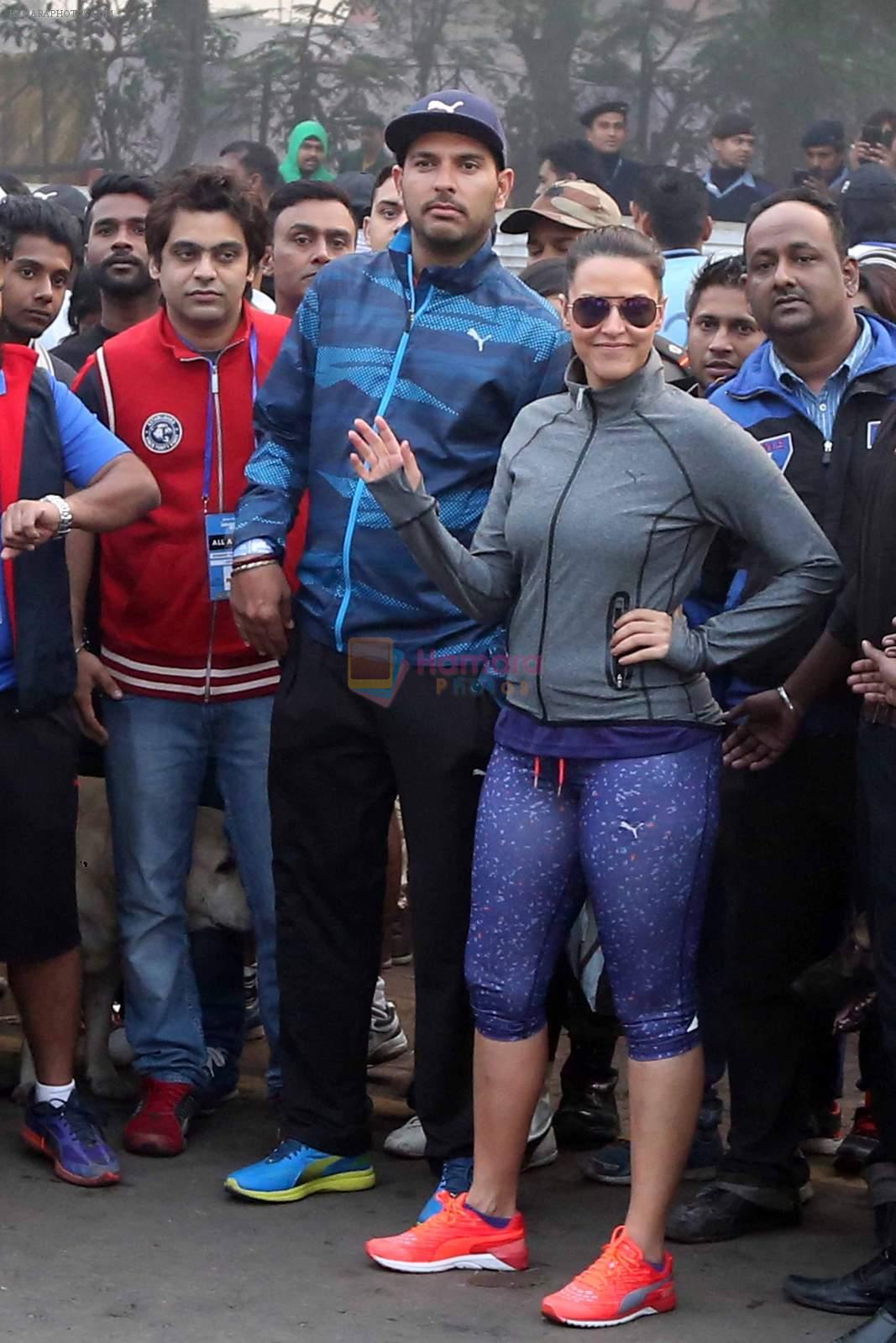 Neha Dhupia and Yuvraj Singh in Kolkatta for a marathon on 22nd Dec 2015