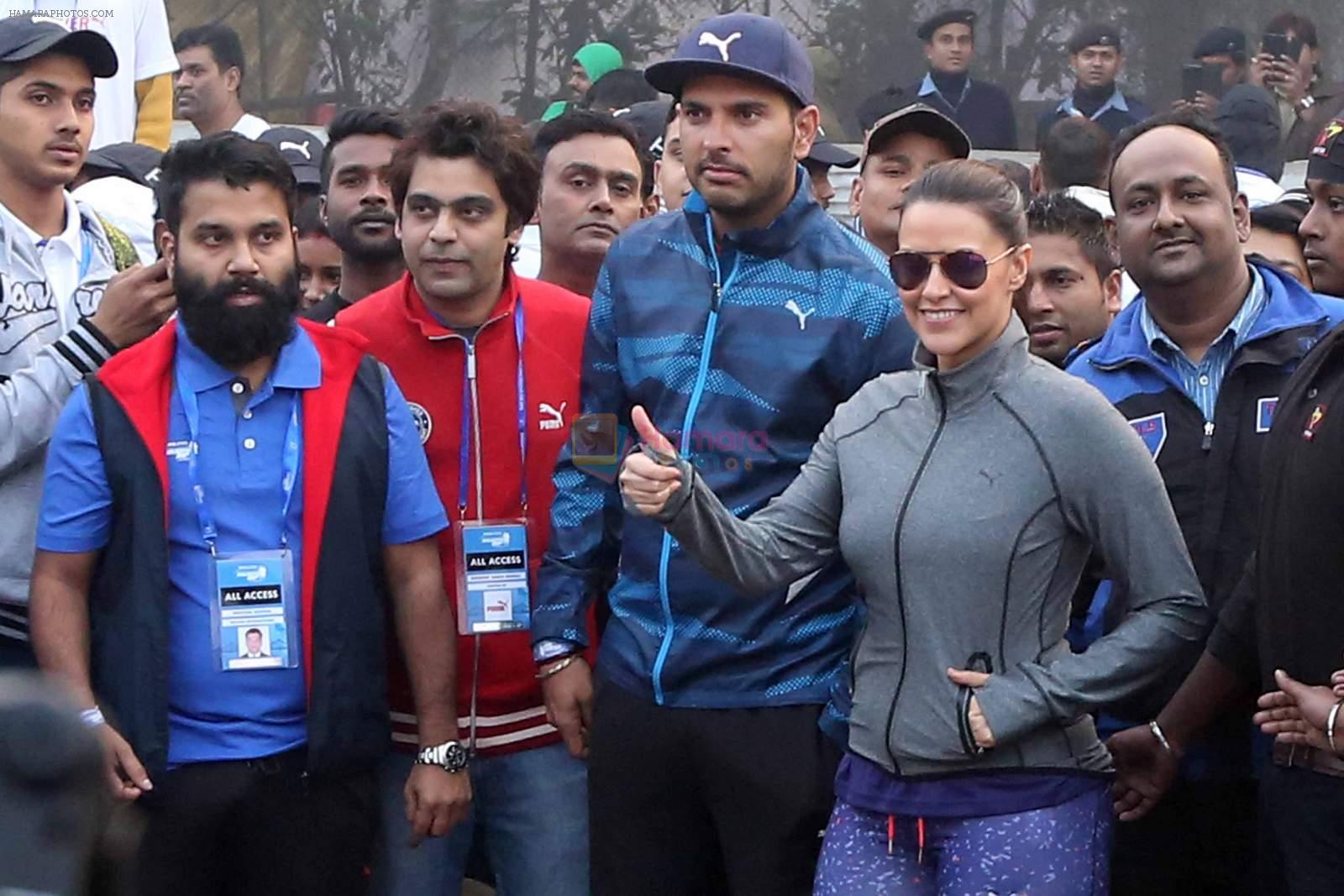 Neha Dhupia and Yuvraj Singh in Kolkatta for a marathon on 22nd Dec 2015