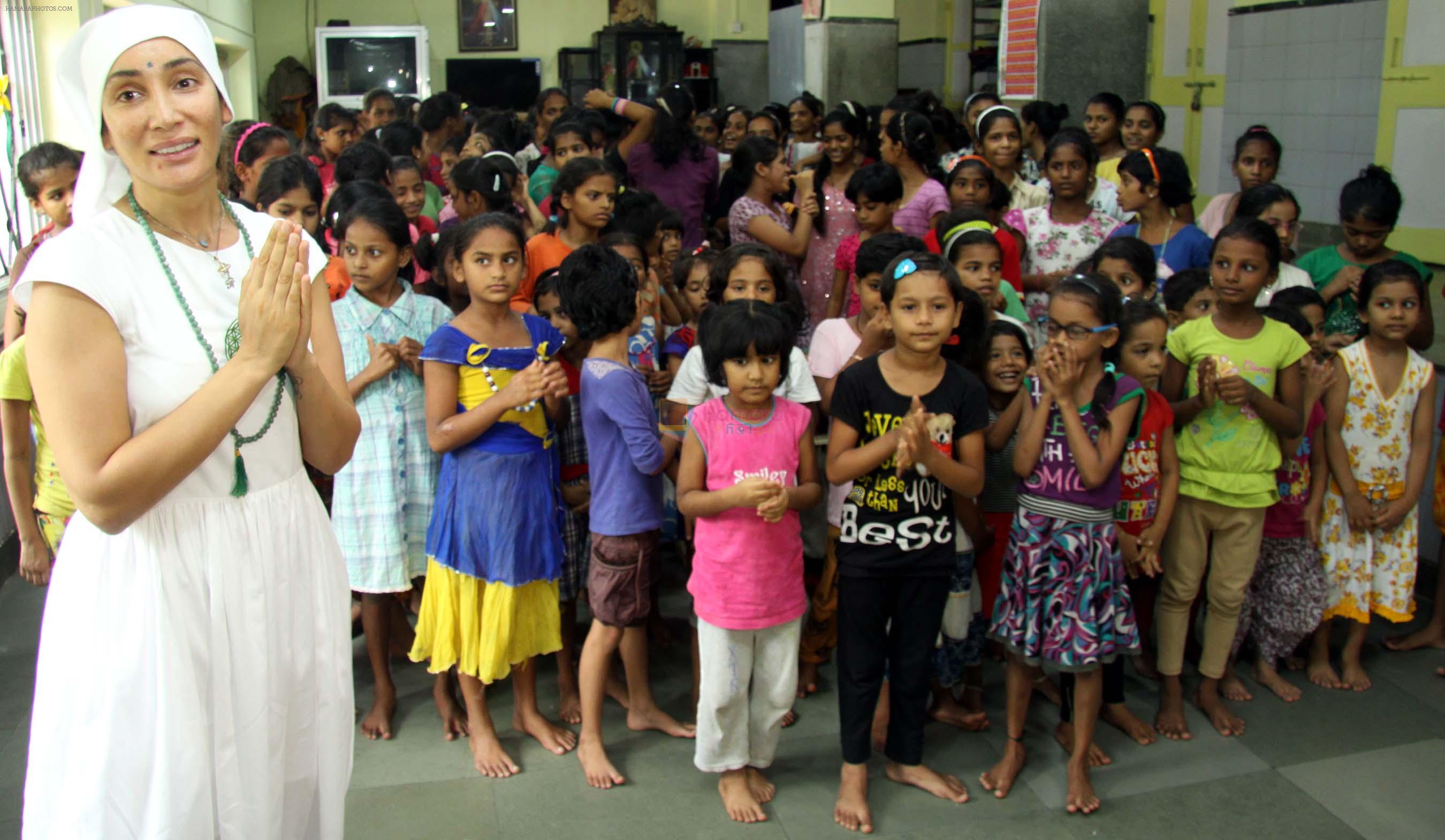 Gaia Mother Sofia distributed note books,bags to 140 girls of Bal Bhawan NGO at Andheri on 4th July 2016