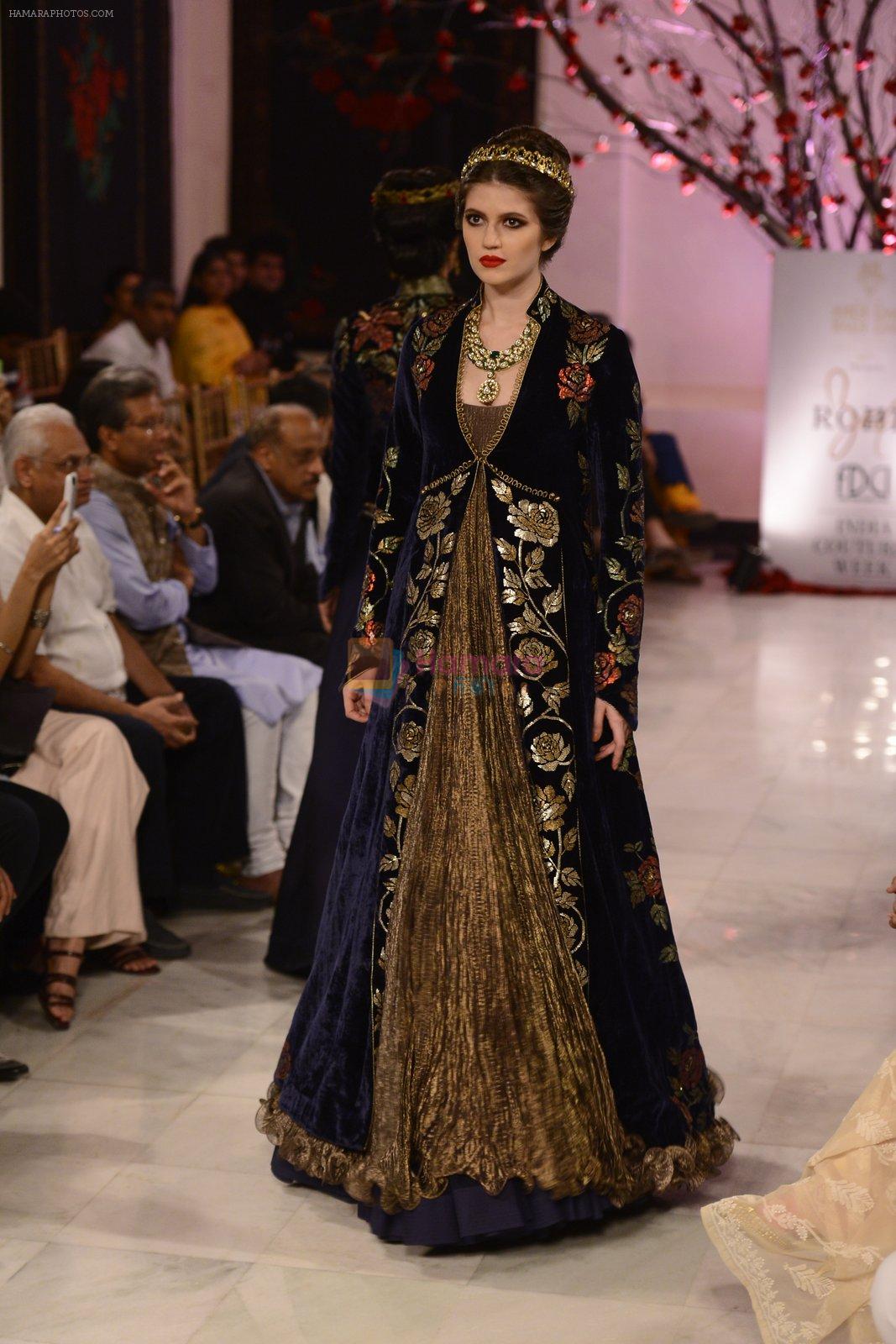 Models walk the ramp displaying Rohit Bal's latest collection Kehkashaan at the India Couture Week 2016 on July 24, 2016