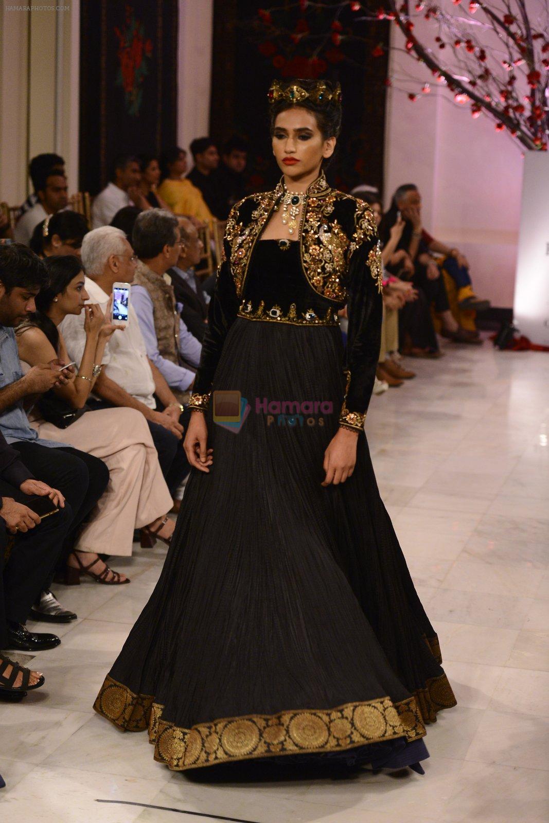 Models walk the ramp displaying Rohit Bal's latest collection Kehkashaan at the India Couture Week 2016 on July 24, 2016