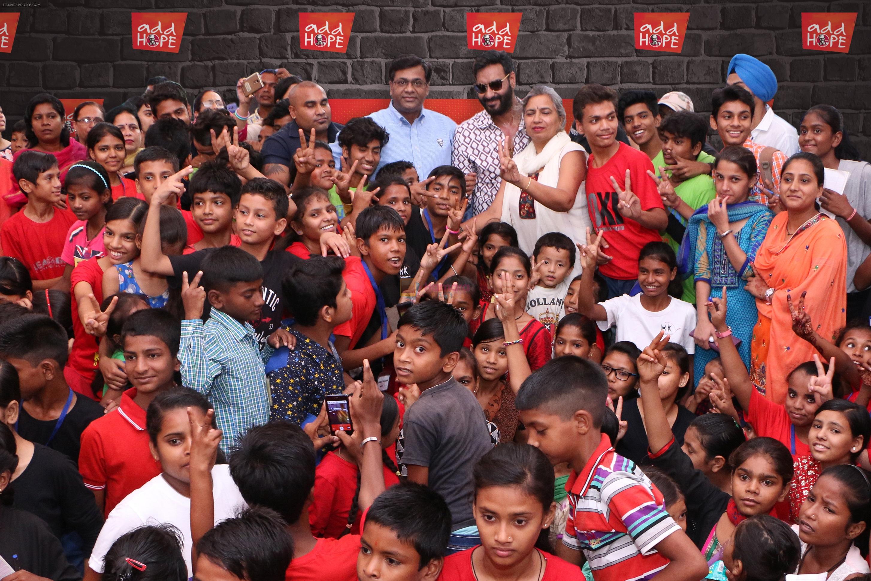 Praveen Reddy, Director, Restaurant Excellence and Area Countries, KFC India and Hope ambassador Ajay Devgn with kids at Hamaari Kaksha during add HOPE event in Chandigarh - Copy