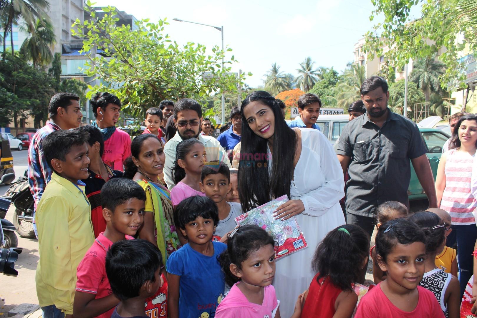 Poonam Pandey Distribute Raincoat To Neddy Kids on 30th May 2017