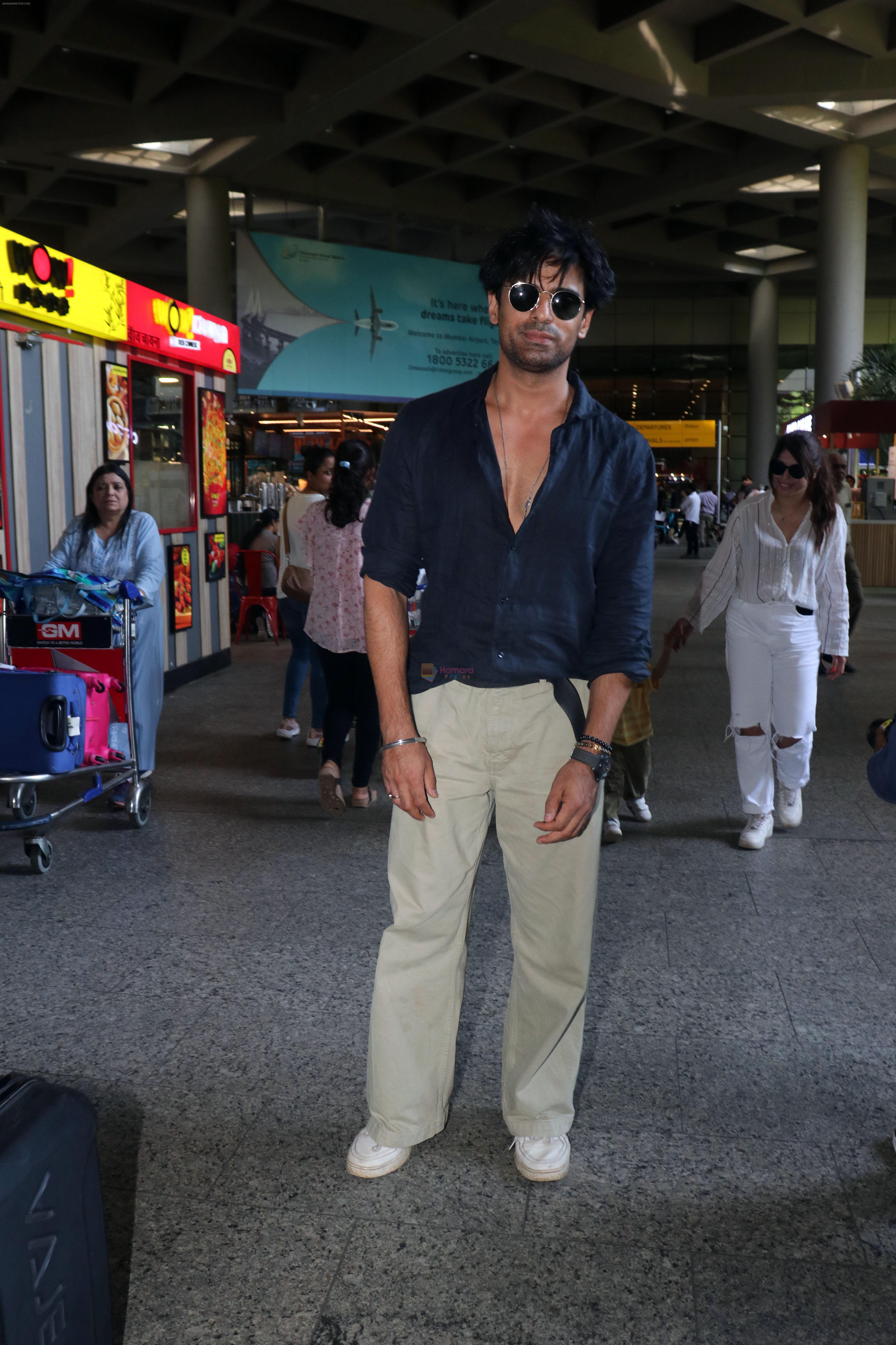 Mohit Malik, Addite Malik along with their child at the aiport on 20th May 2023