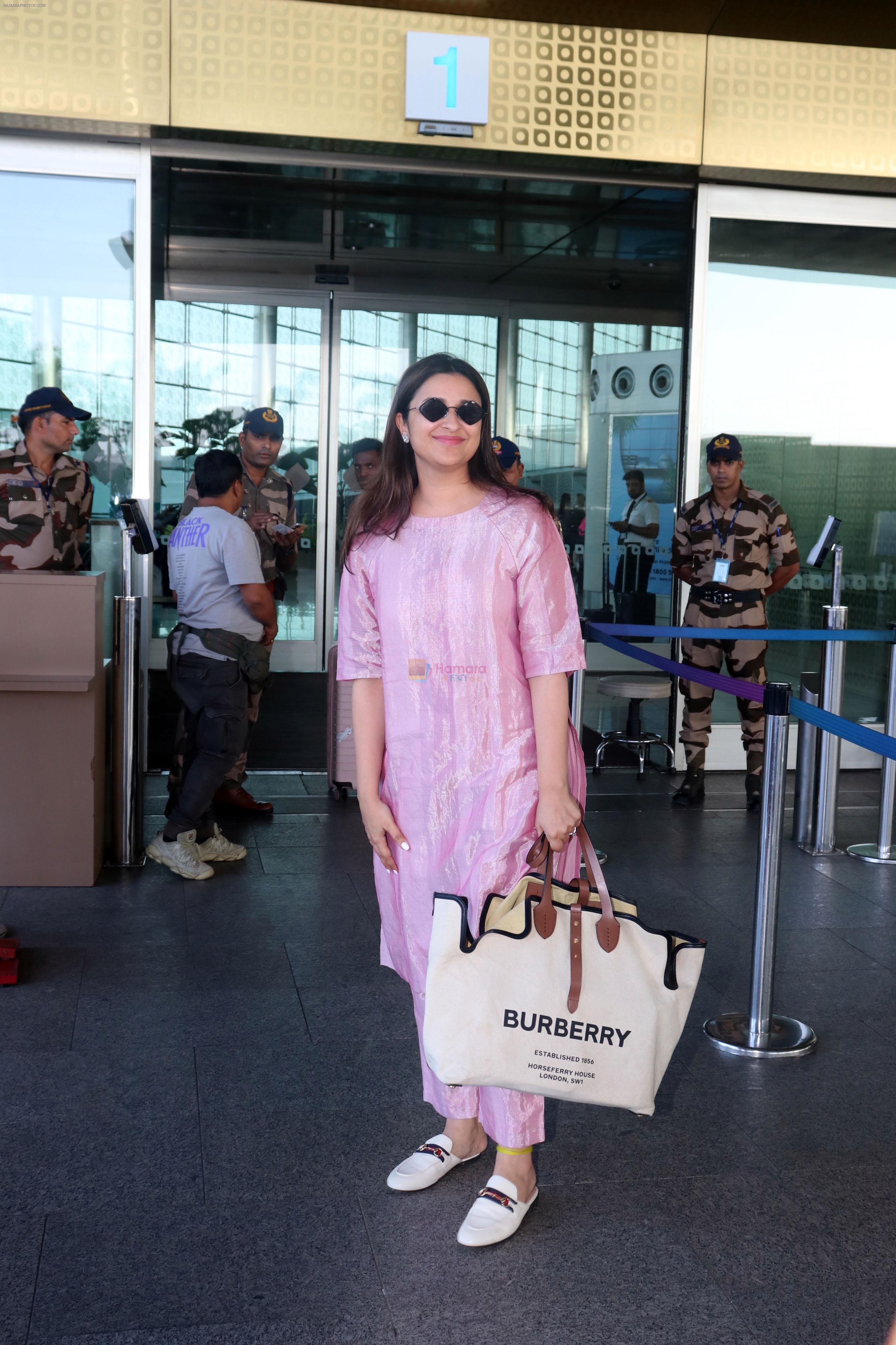 Parineeti Chopra wearing a bright pink dress white shoes sunglasses Burberry Horseferry Print Canvas leather handbag