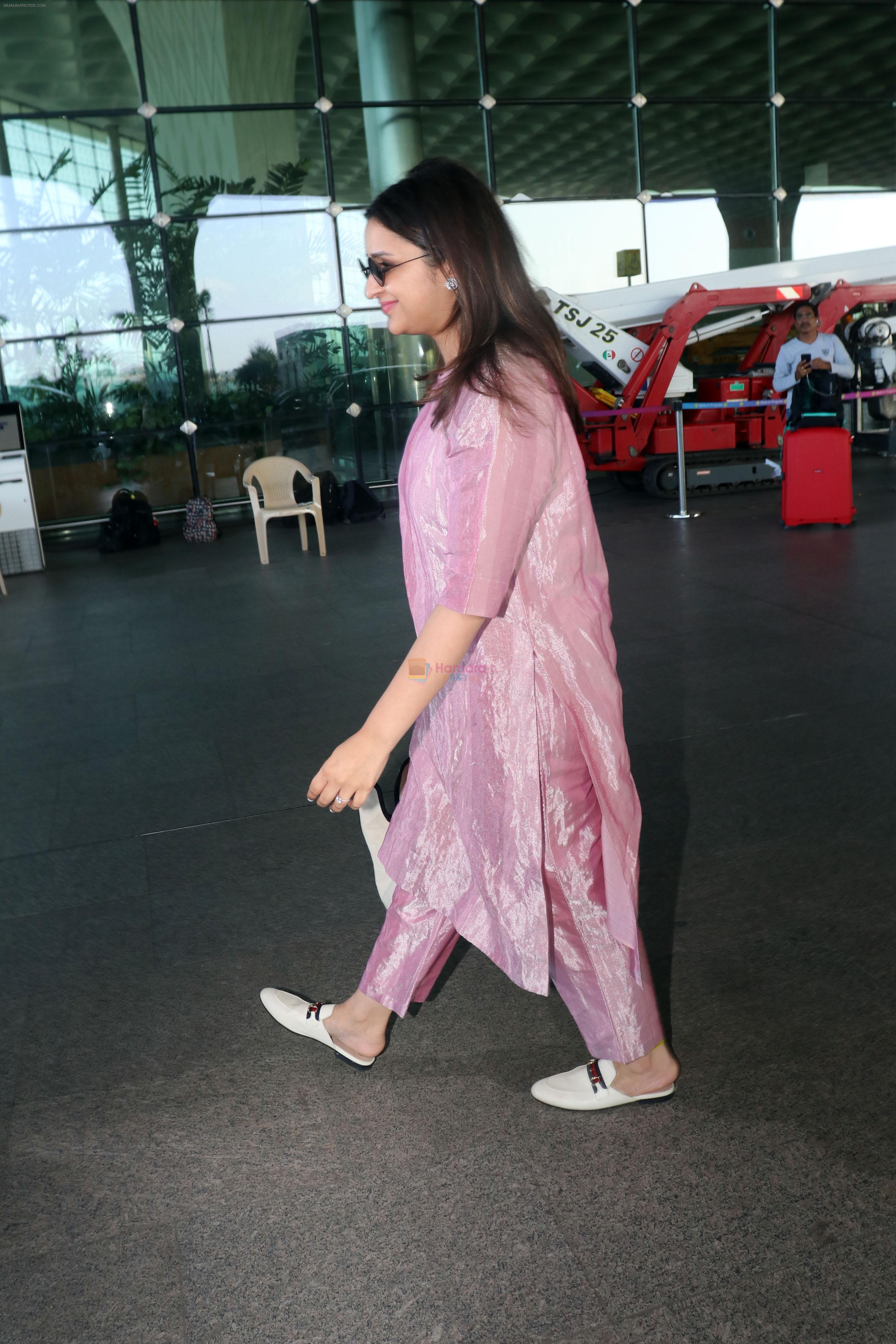 Parineeti Chopra wearing a bright pink dress white shoes sunglasses Burberry Horseferry Print Canvas leather handbag