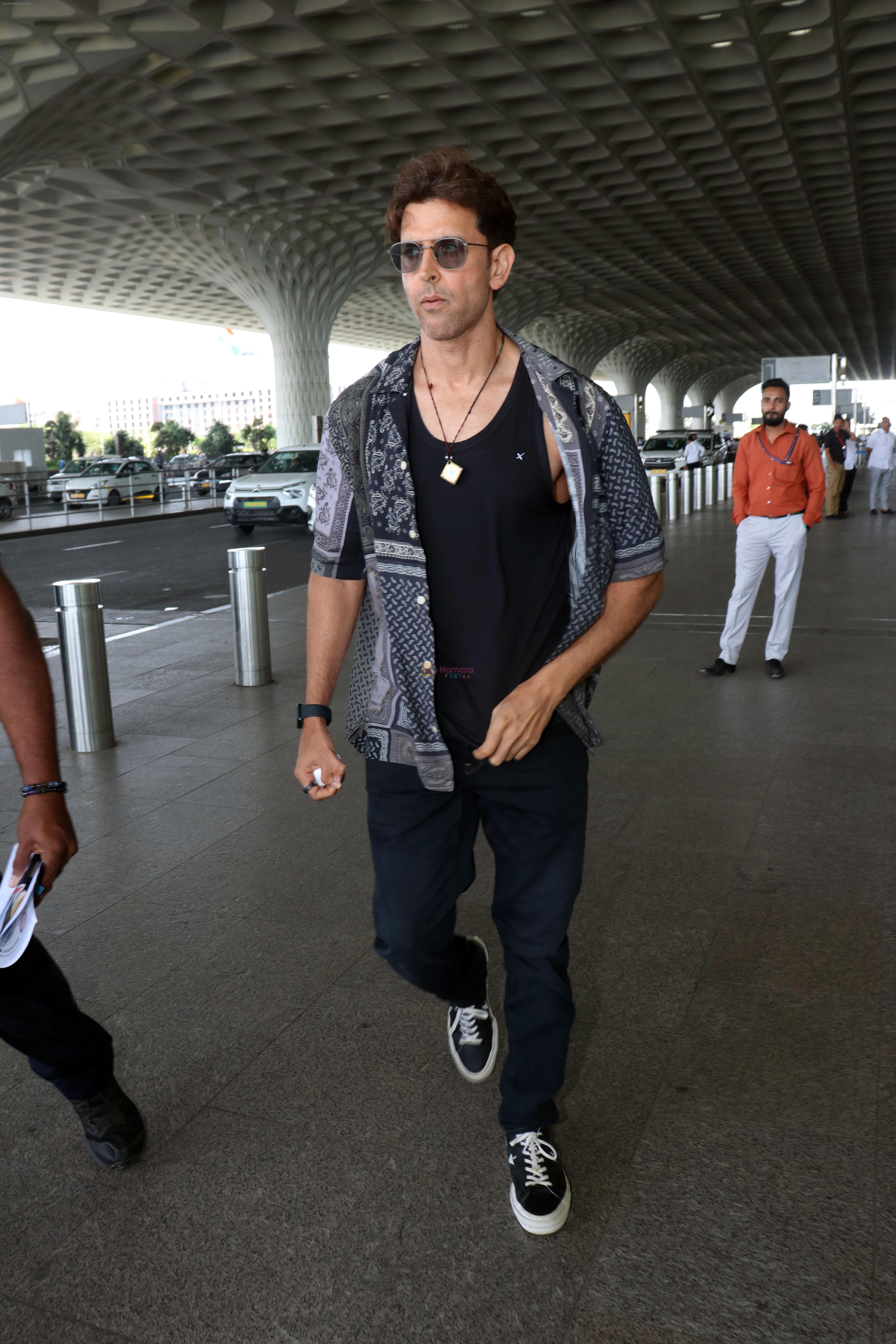 Hrithik Roshan in black teas unbuttoned shirt dark blue jeans and Converse Cons One Star Pro OX Shoes