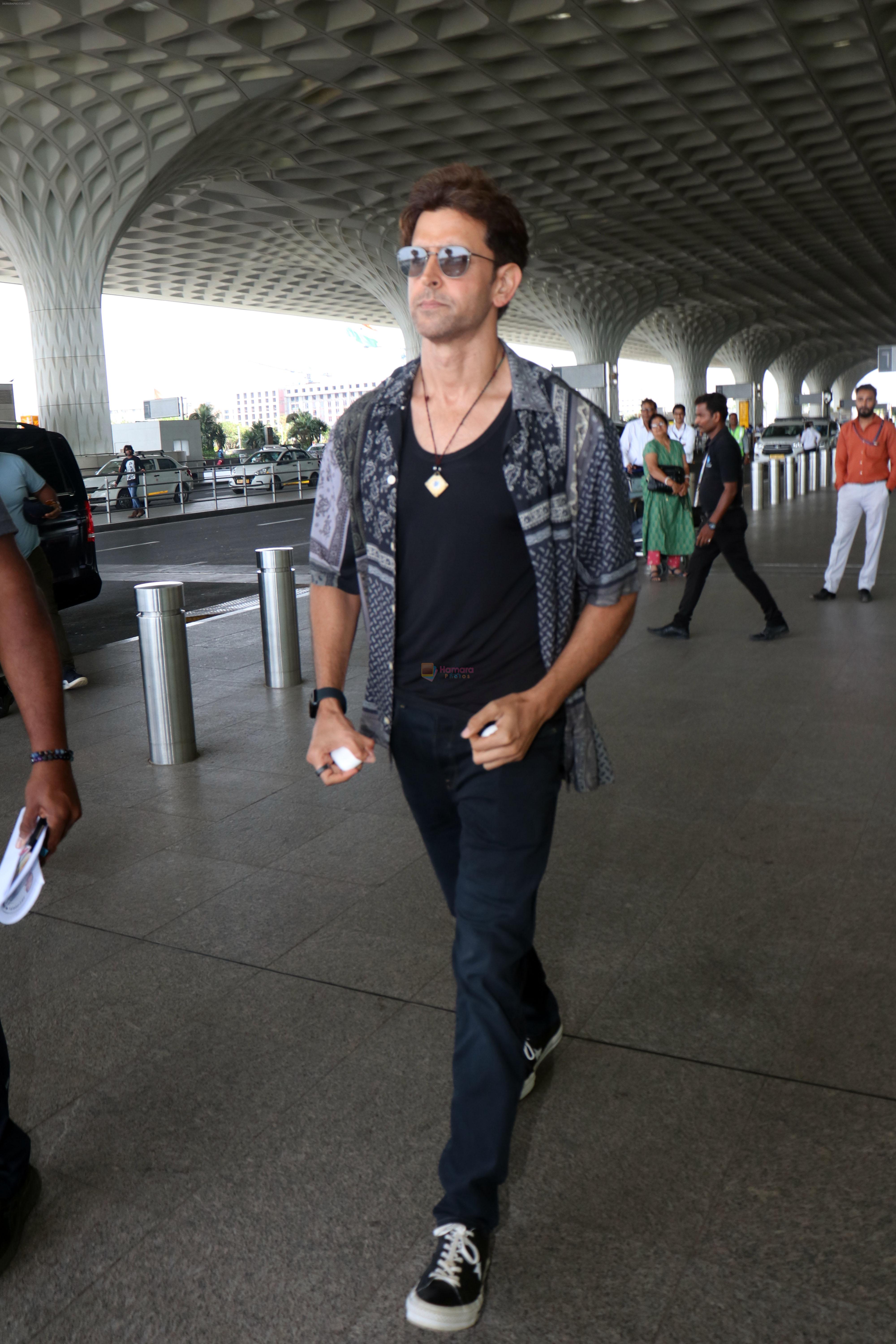 Hrithik Roshan in black teas unbuttoned shirt dark blue jeans and Converse Cons One Star Pro OX Shoes