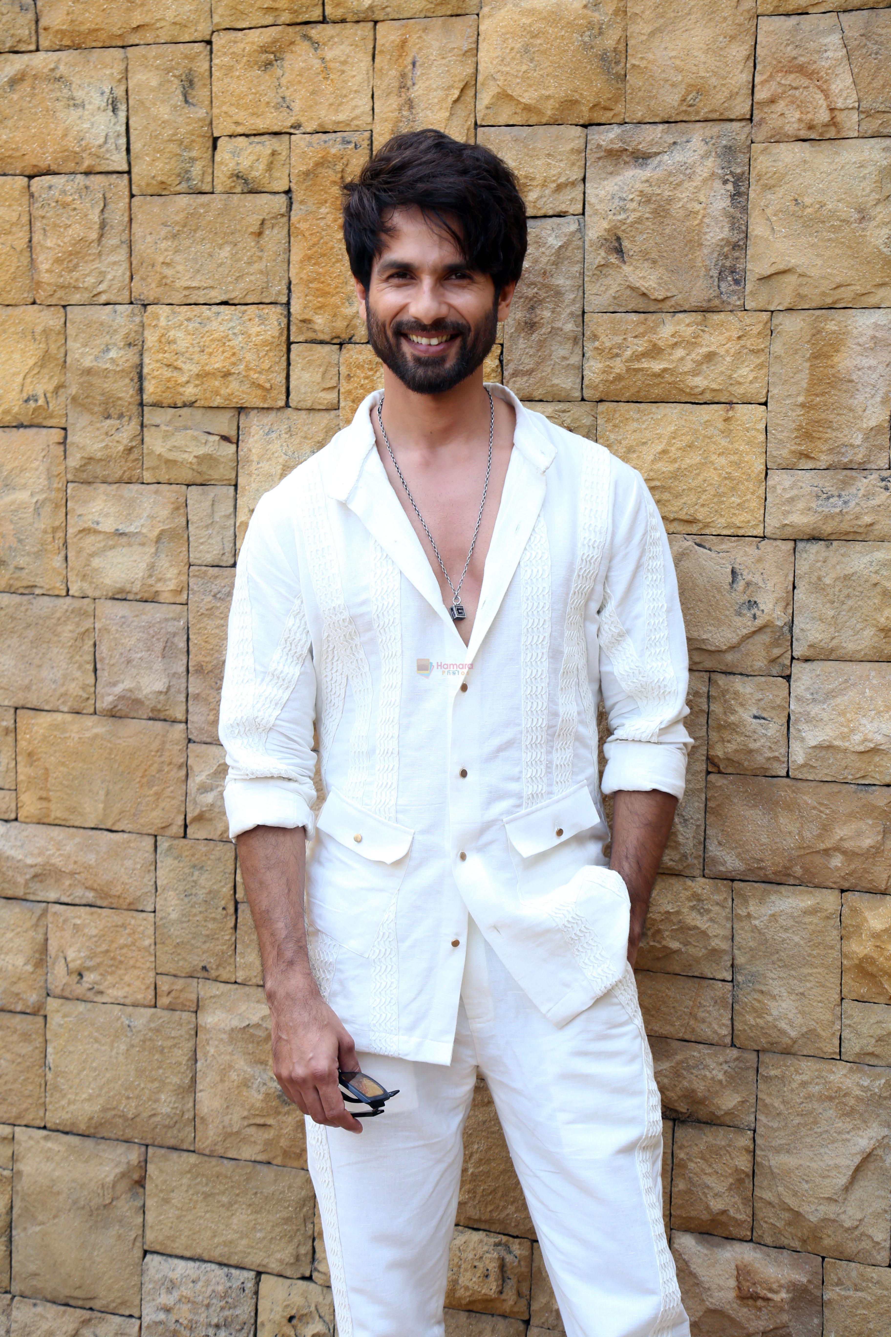 Shahid Kapoor dressed in white shirt and pant and sunglasses promoting his film Bloody Daddy