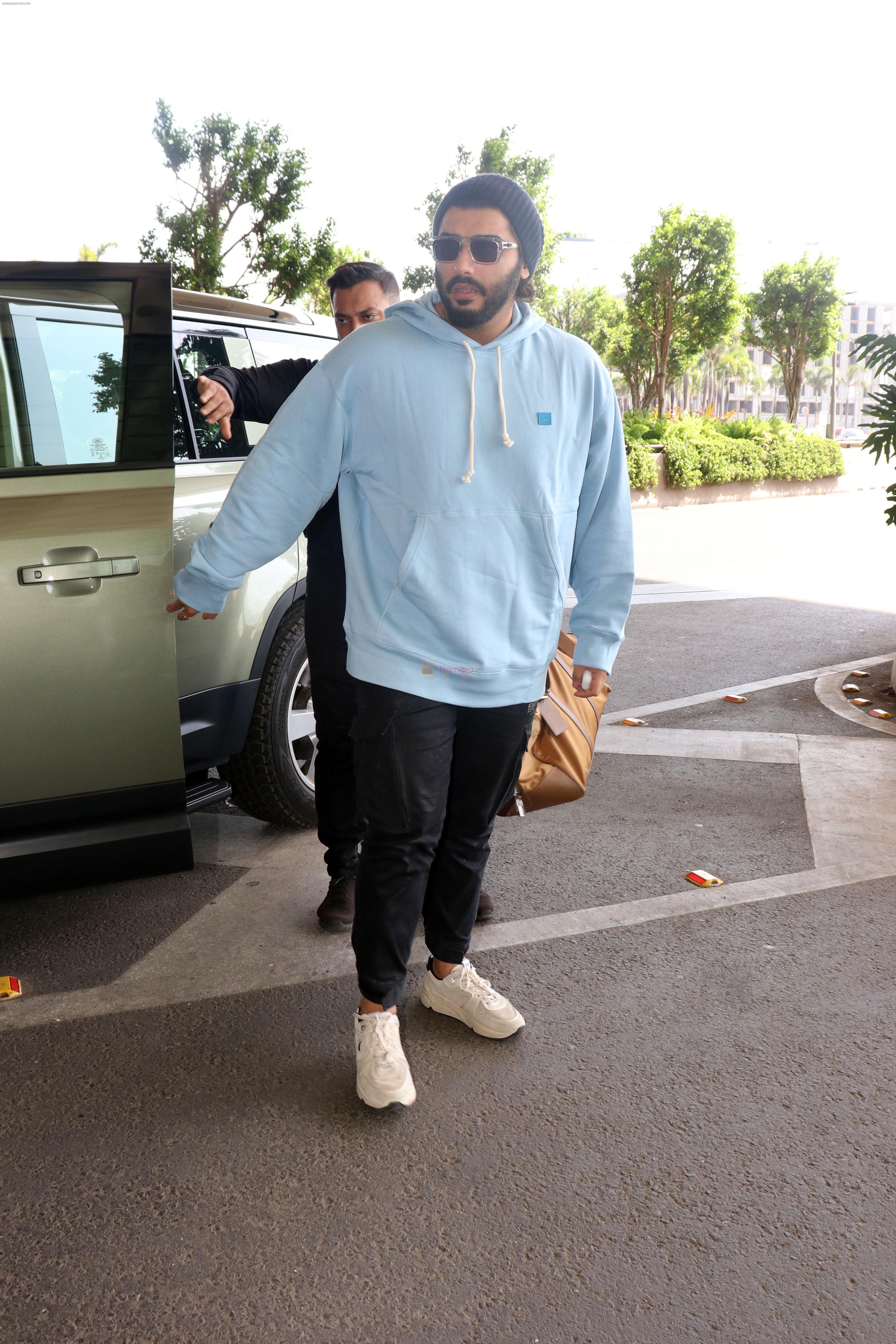 Arjun Kapoor with sunglasses on wearing Powder Blue Hooded