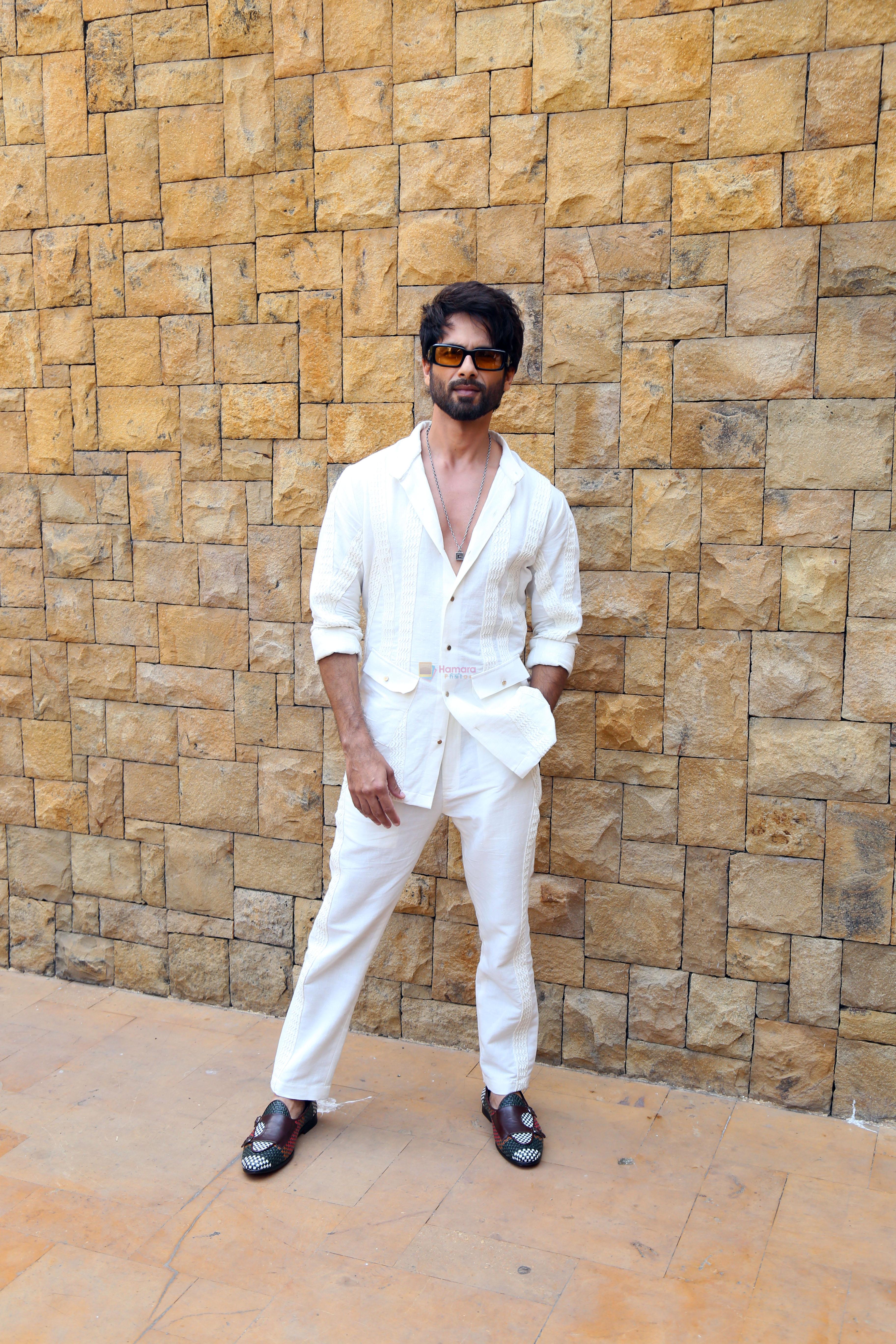 Shahid Kapoor dressed in white shirt and pant and sunglasses promoting his film Bloody Daddy