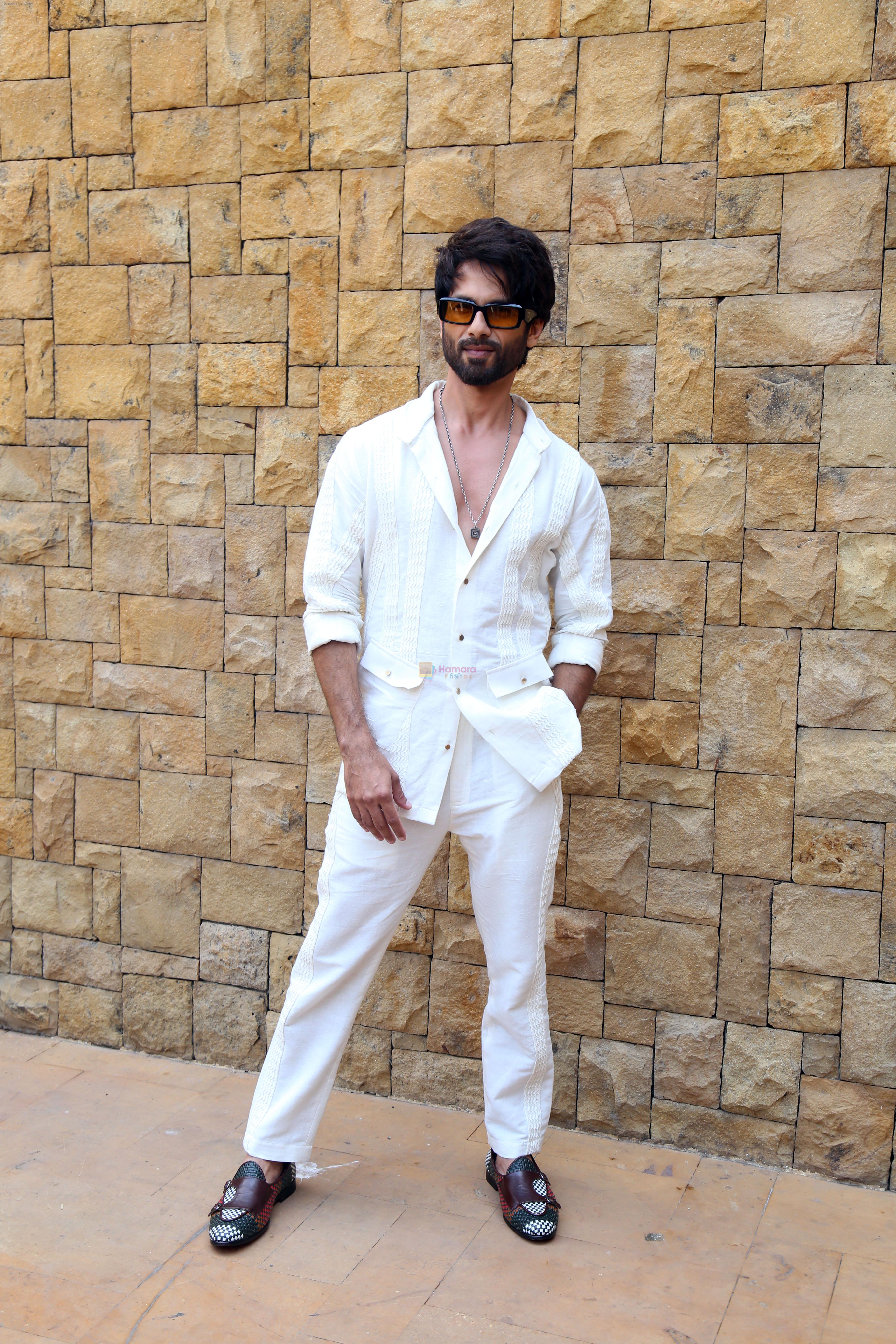 Shahid Kapoor dressed in white shirt and pant and sunglasses promoting his film Bloody Daddy