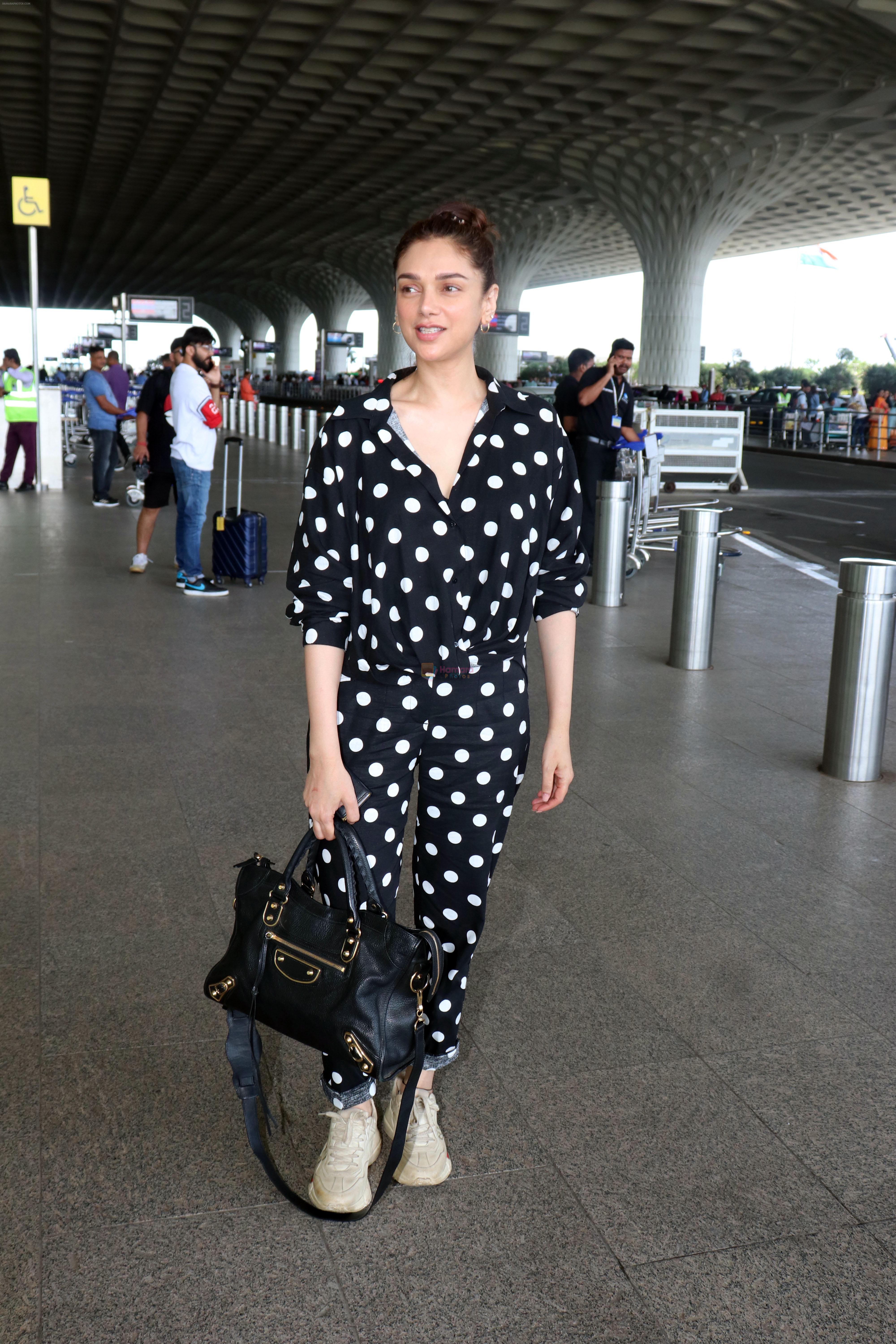 Aditi Rao Hydari holding black leather Balenciaga handbag wearing Polka Dots Richie Freeman outfit and Gucci Leather sneakers