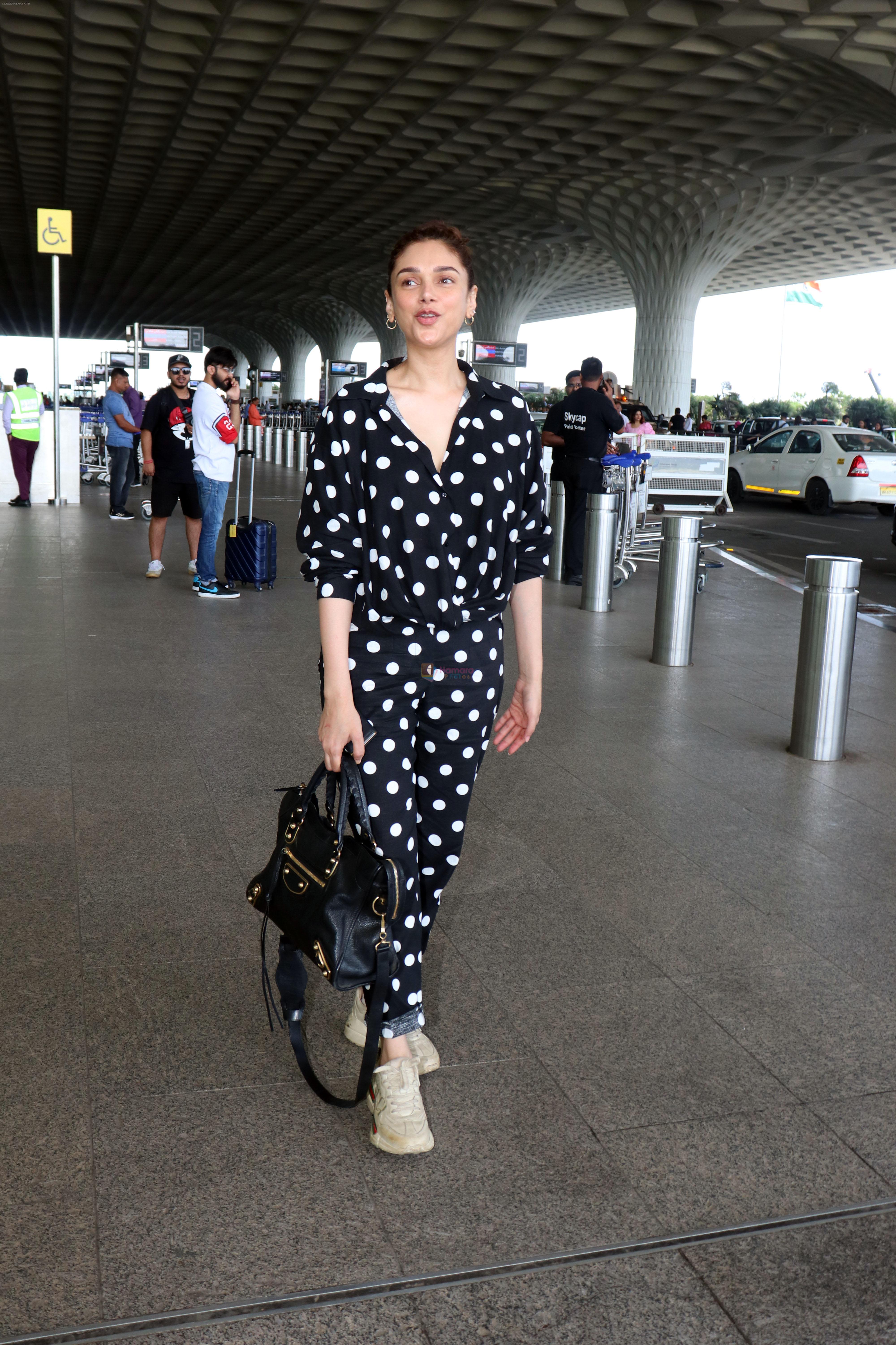 Aditi Rao Hydari holding black leather Balenciaga handbag wearing Polka Dots Richie Freeman outfit and Gucci Leather sneakers