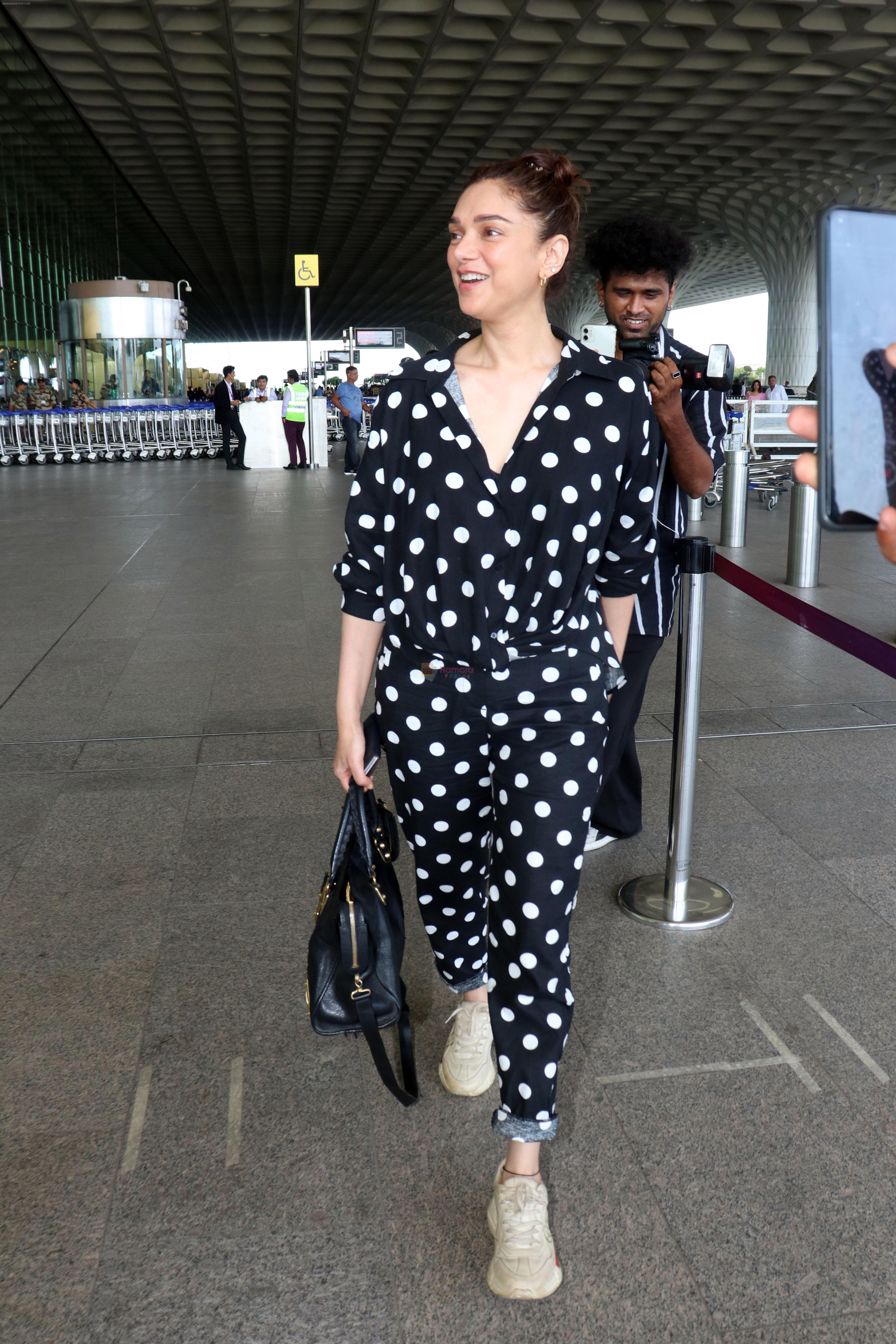 Aditi Rao Hydari holding black leather Balenciaga handbag wearing Polka Dots Richie Freeman outfit and Gucci Leather sneakers