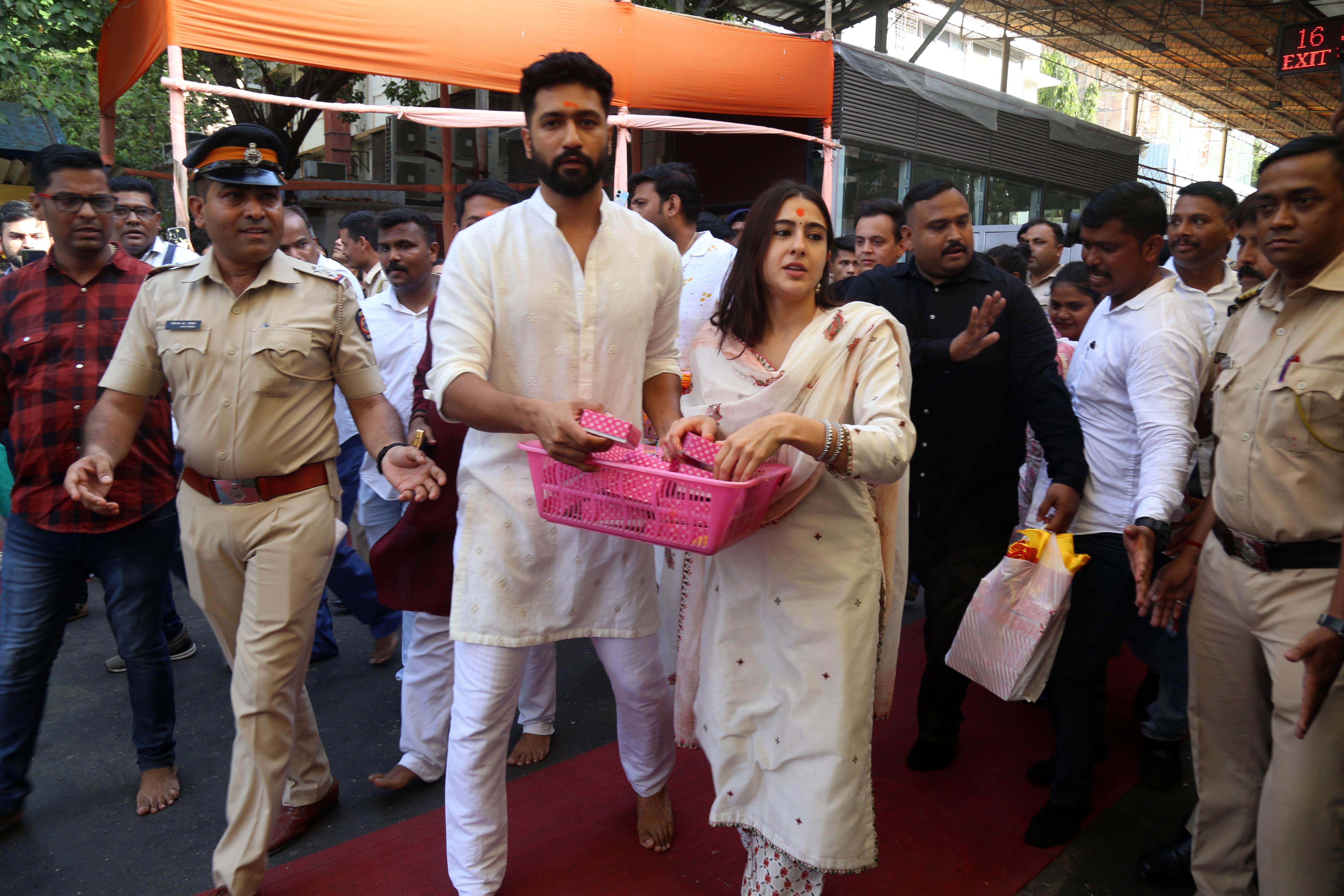 Vicky Kaushal And Sara Ali Khan distribute sweet packets at Shree Siddhivinayak Ganapati Mandir and seek blessings for their movie Zara Hatke Zara Bachke