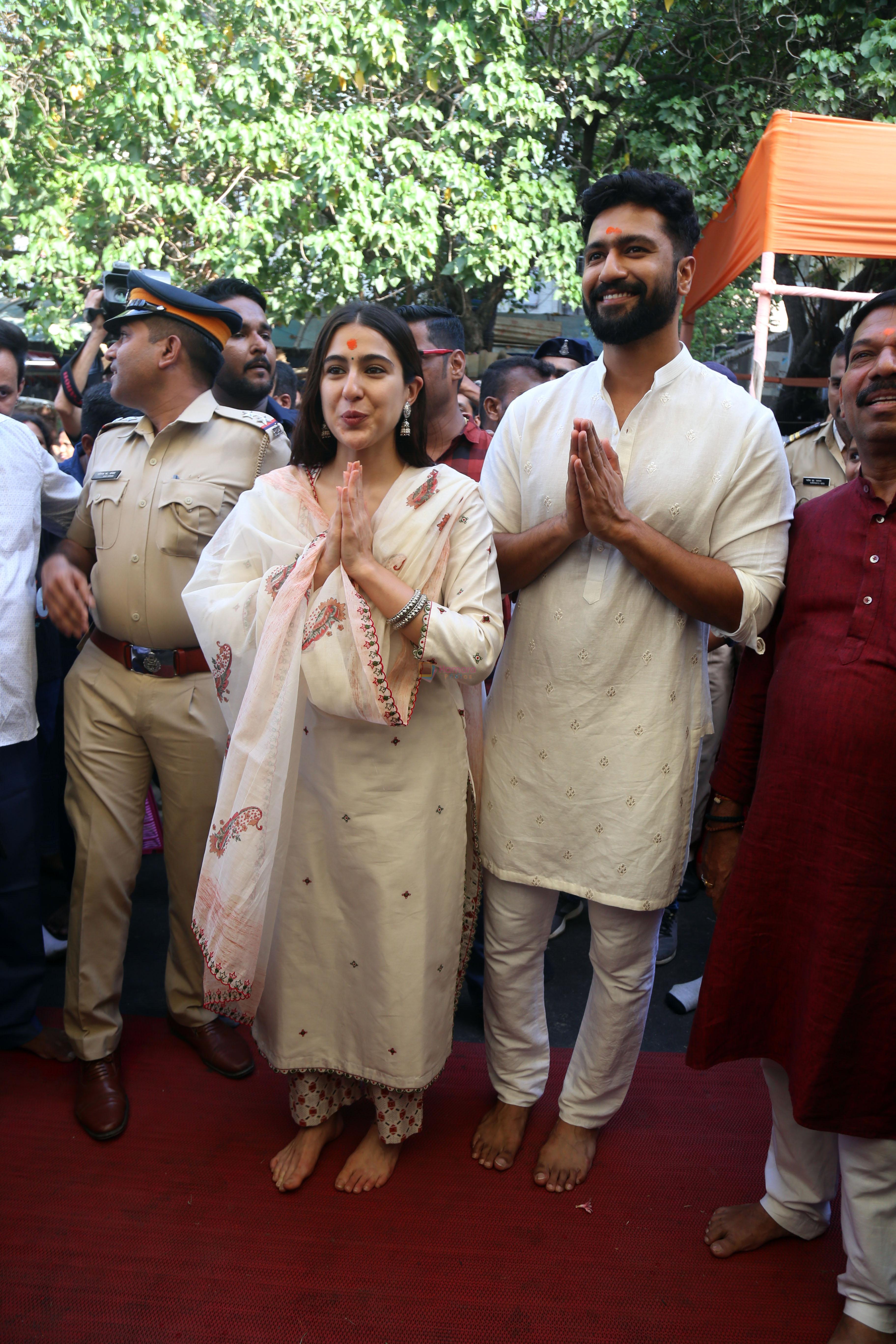 Vicky Kaushal And Sara Ali Khan distribute sweet packets at Shree Siddhivinayak Ganapati Mandir and seek blessings for their movie Zara Hatke Zara Bachke