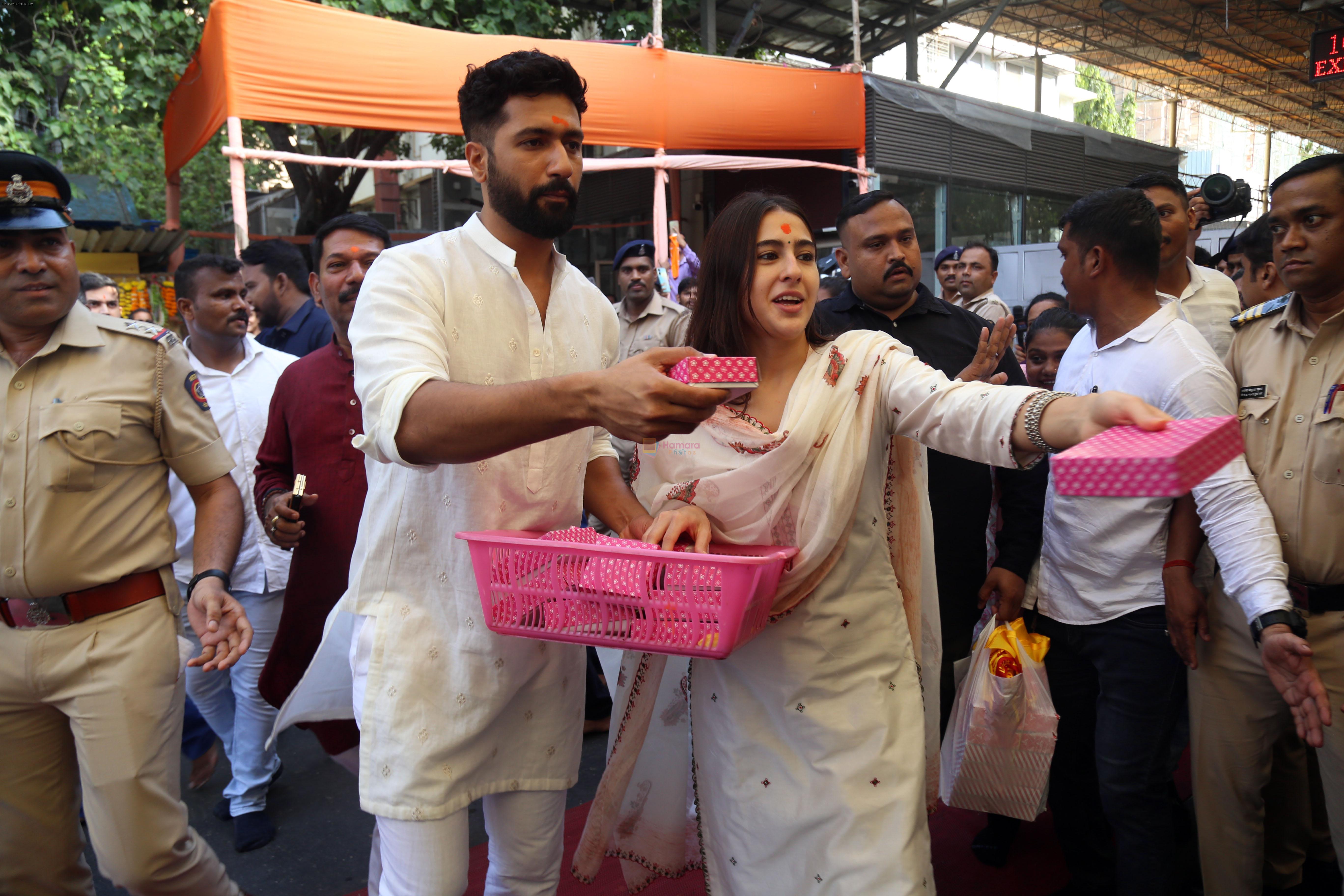 Vicky Kaushal And Sara Ali Khan distribute sweet packets at Shree Siddhivinayak Ganapati Mandir and seek blessings for their movie Zara Hatke Zara Bachke