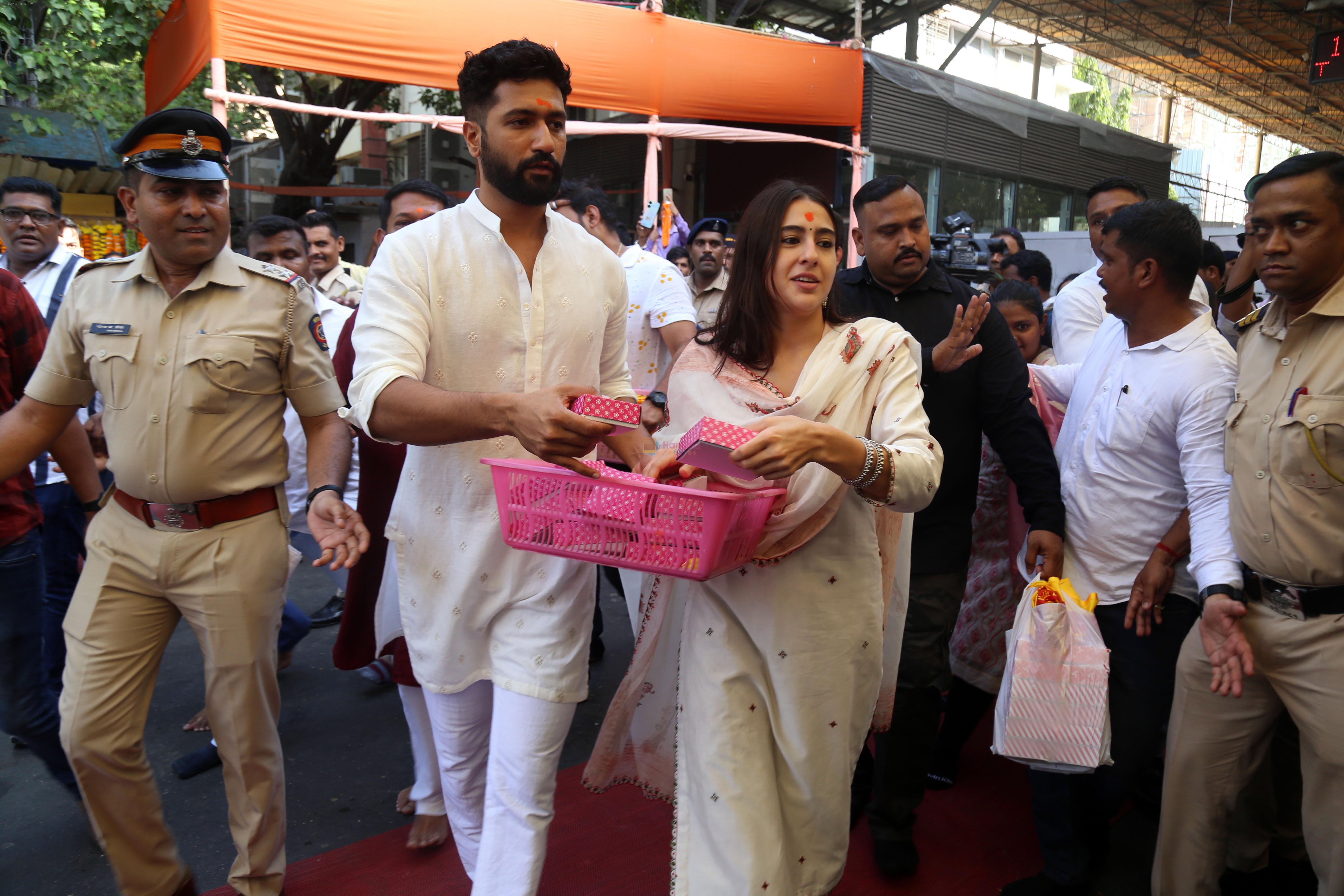 Vicky Kaushal And Sara Ali Khan distribute sweet packets at Shree Siddhivinayak Ganapati Mandir and seek blessings for their movie Zara Hatke Zara Bachke