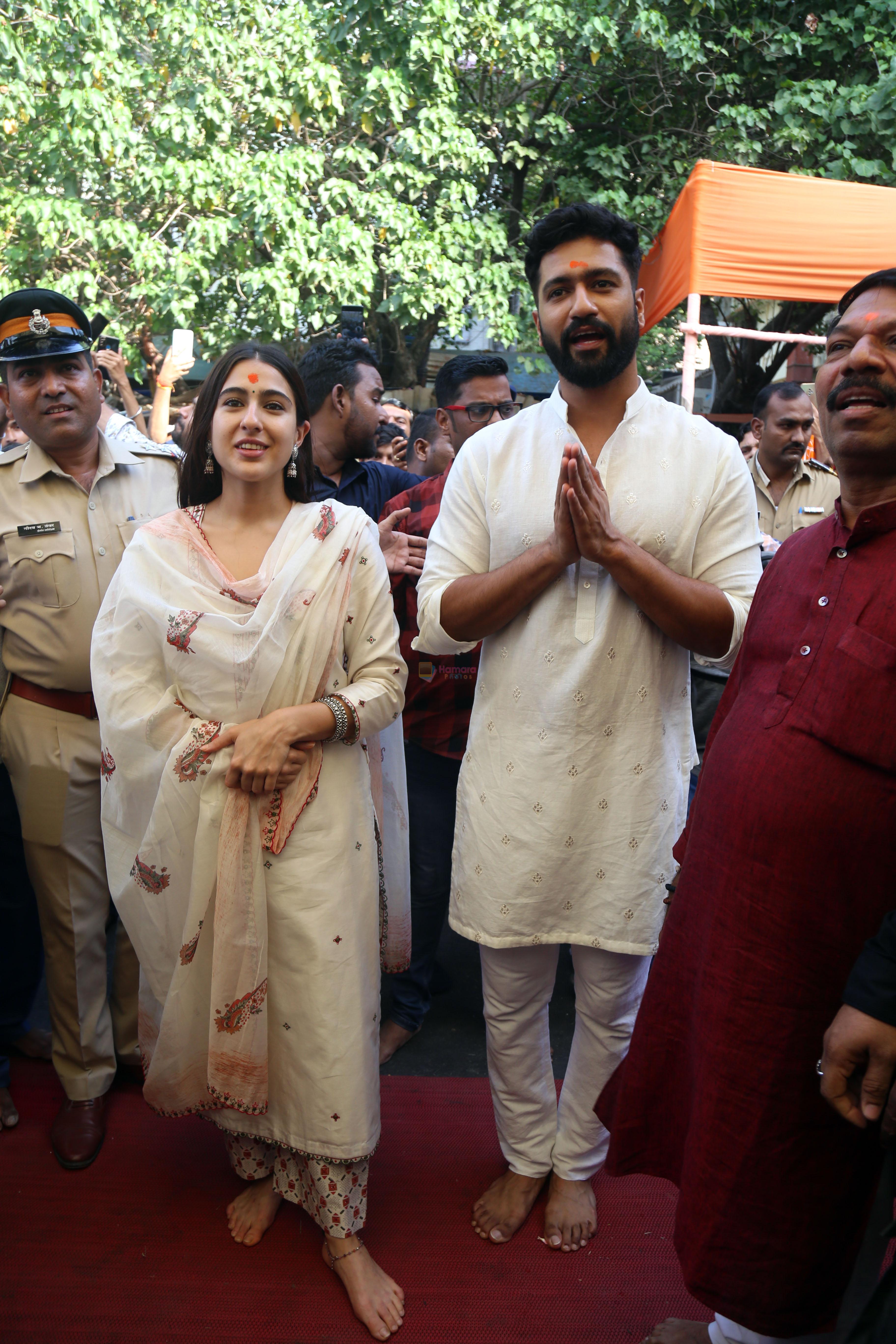 Vicky Kaushal And Sara Ali Khan distribute sweet packets at Shree Siddhivinayak Ganapati Mandir and seek blessings for their movie Zara Hatke Zara Bachke